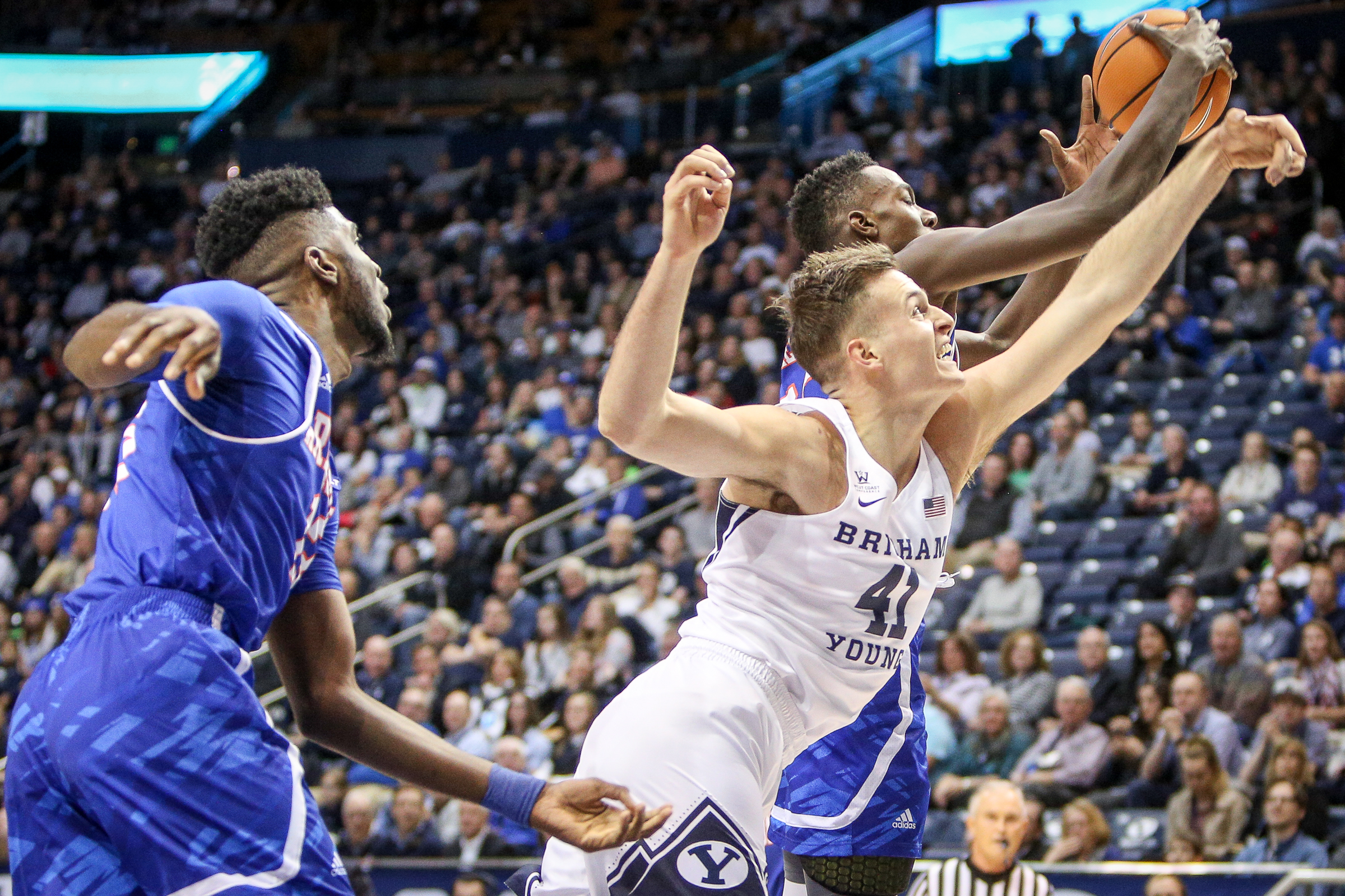 BYU forward Luke Worthington (41) fights for a rebound with Texas-Arlington forward Kevin Hervey (25) as BYU hosts UT Arlington at the Marriott Center in Provo on Saturday, Nov. 18, 2017. (Photo: Adam Fondren, Deseret News)