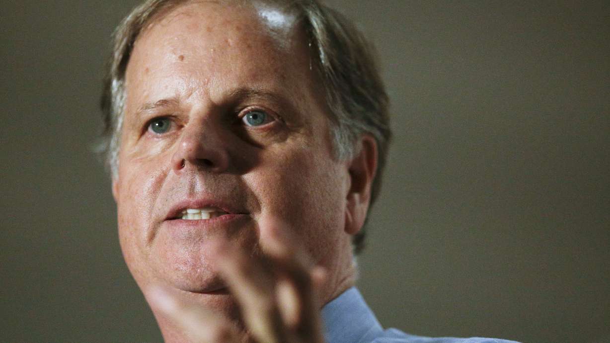 The Latest: PAC group that backed Trump supports Moore