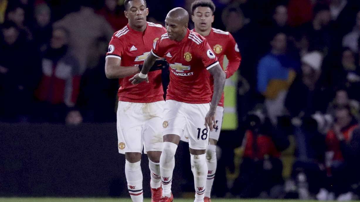 Man United beats Watford 4-2 to keep in sight of City