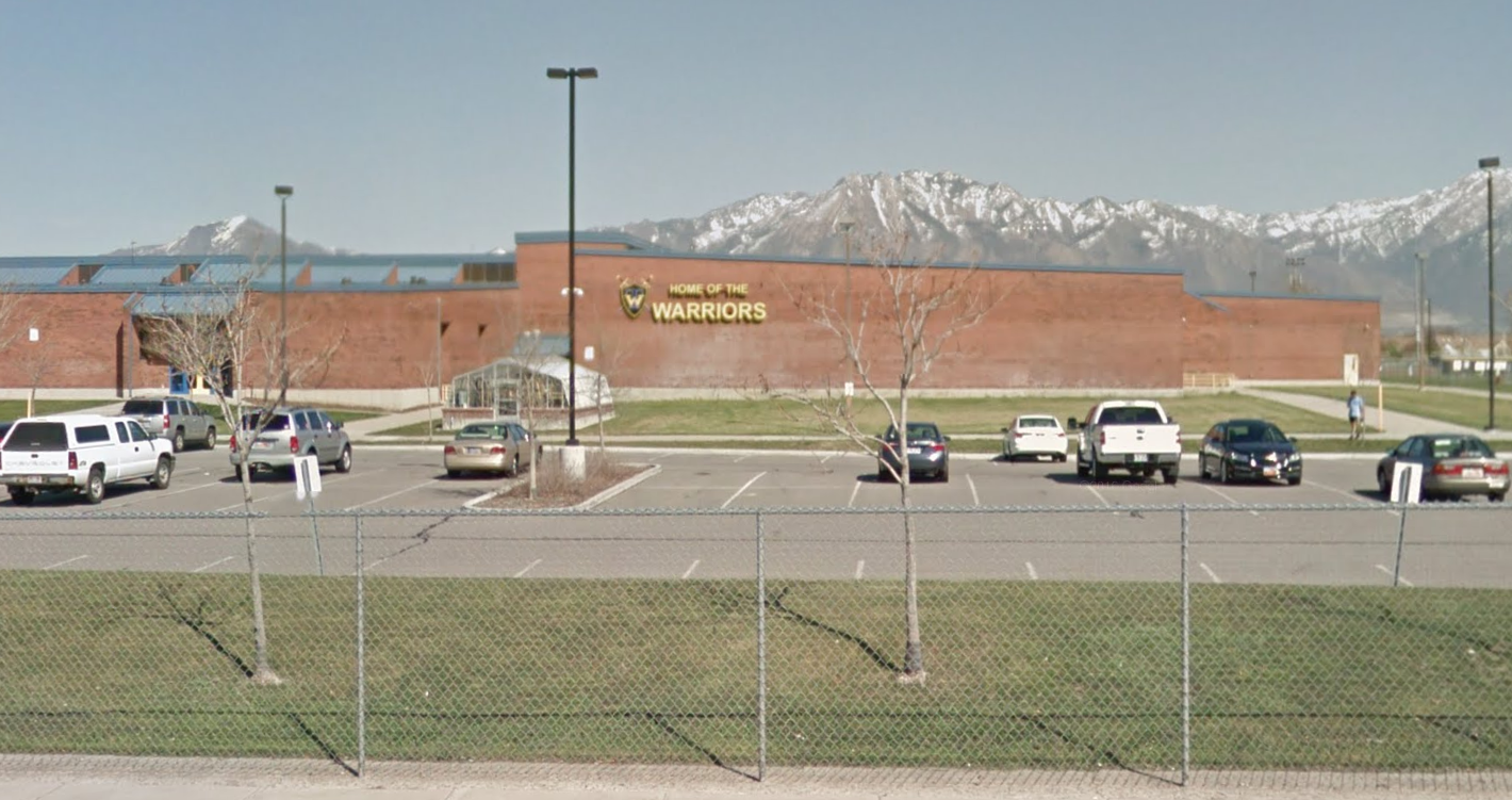 Utah schoolteacher hangs on hood of car as suspects try to run him over, charges say