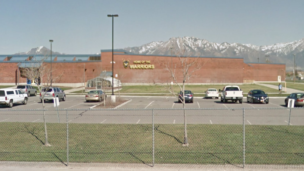 Utah schoolteacher hangs on hood of car as suspects try to run him over, charges say
