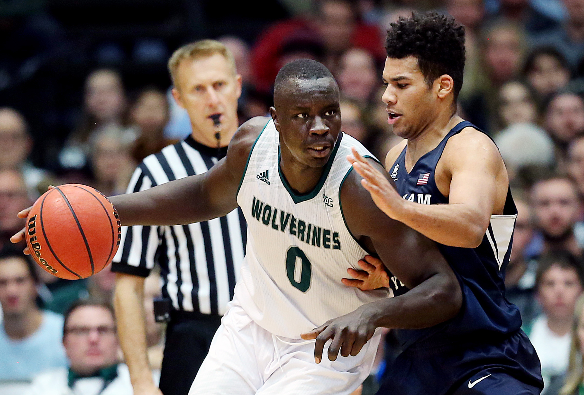 Utah Valley Wolverines center Akolda Manyang (0) goes to work on Brigham Young Cougars forward Yoeli Childs (23) as UVU and BYU play a College basketball game in the UCCU center at UVU in Orem Utah on Wednesday, Nov. 29, 2017. BYU won 85-58. (Photo: Scott G Winterton, Deseret News)
