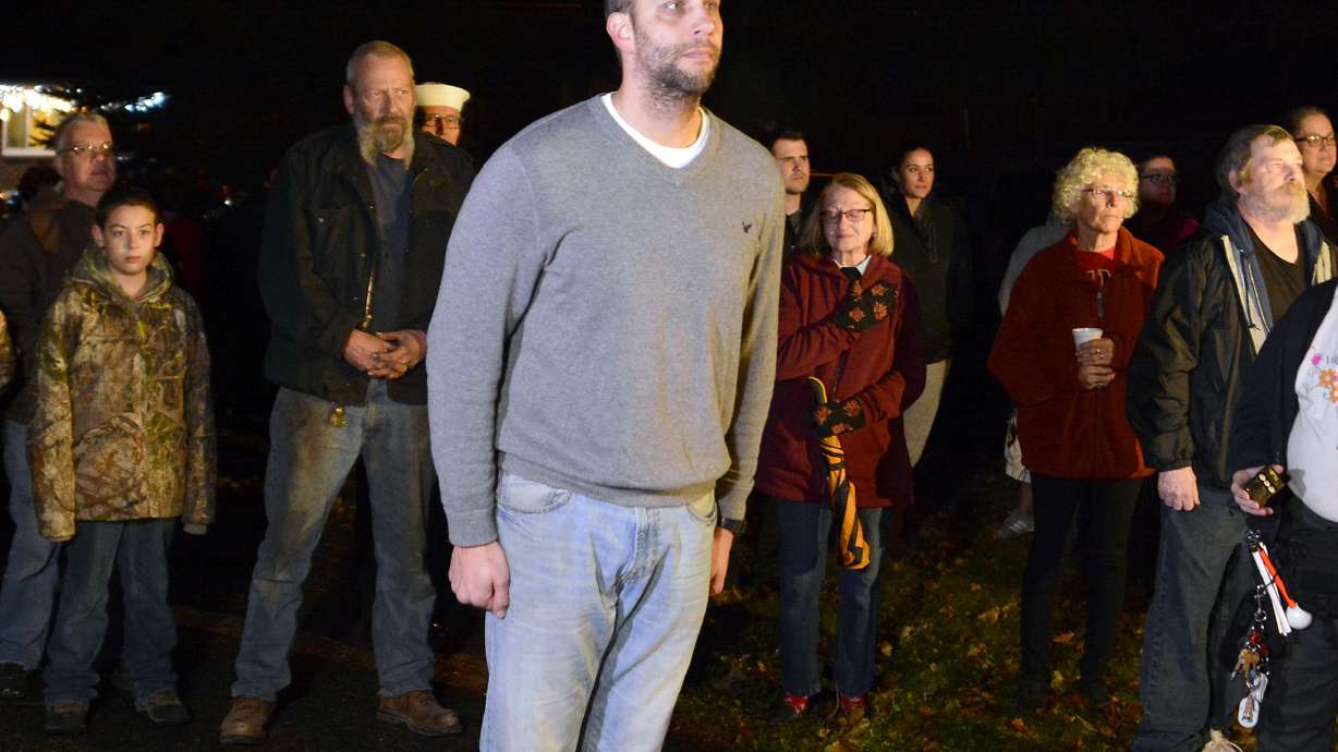 The Latest: Man's loudspeaker broadcast of taps ends