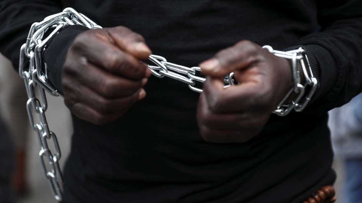 The Latest: France wants African force to help migrants