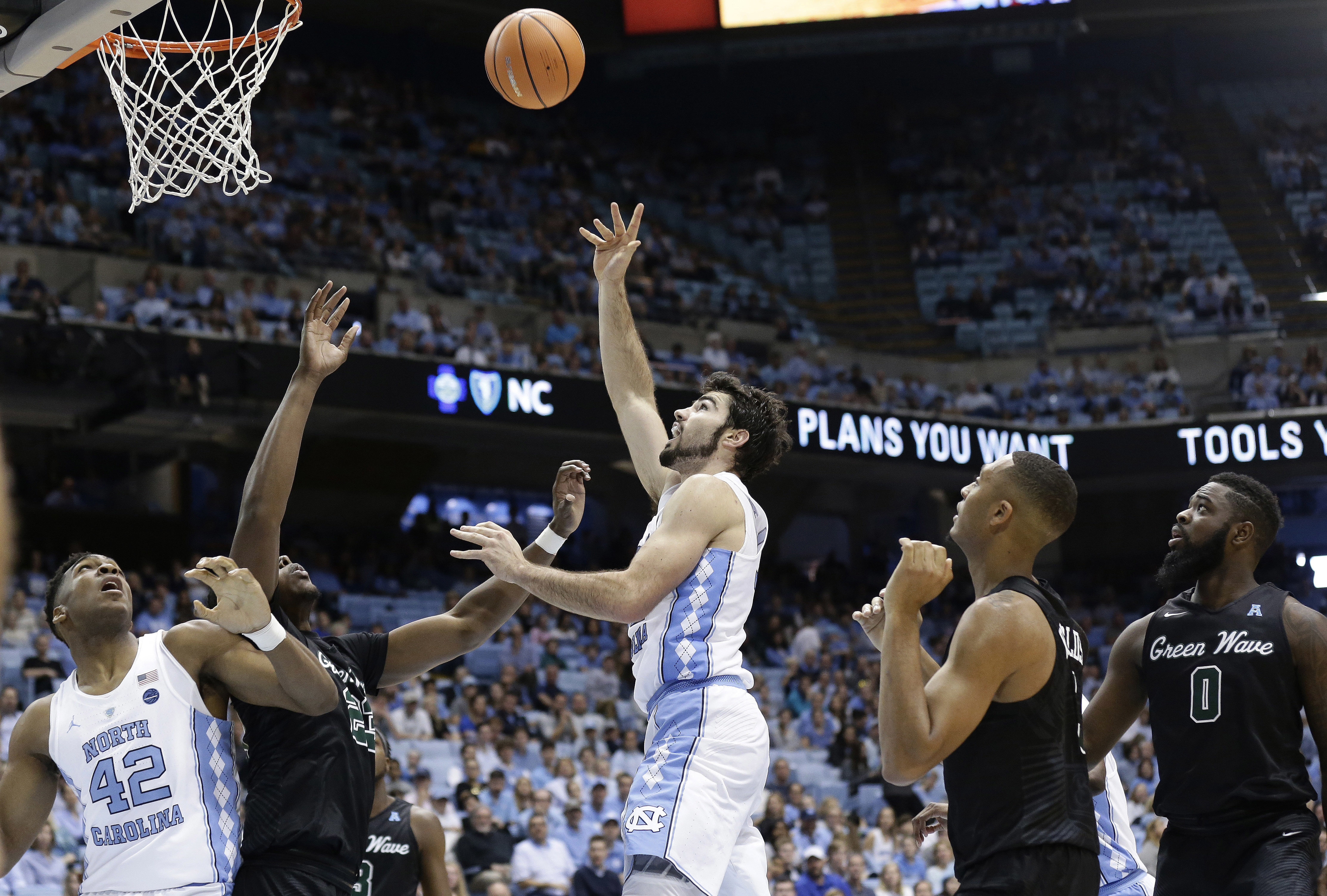 No. 13 UNC shoots nearly 66 percent, routs Tulane 97-73