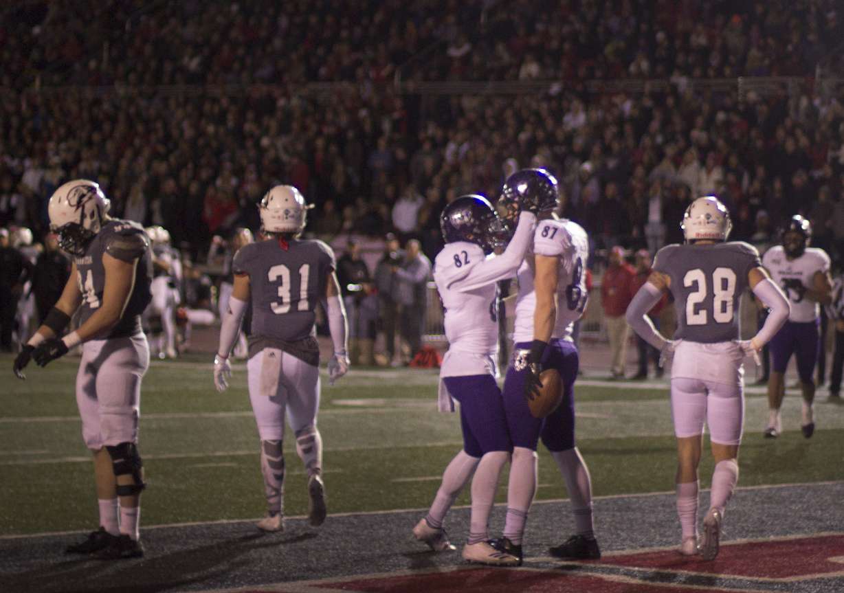 Weber State tight end Andrew Vollert celebrates with wide receiver Ty MacPherson after a touchdown in the third quarter. The Wildcats defeated SUU 30-13 in the second round of the FCS playoffs at Eccles Coliseum in Cedar City on Saturday, Dec. 2, 2017.