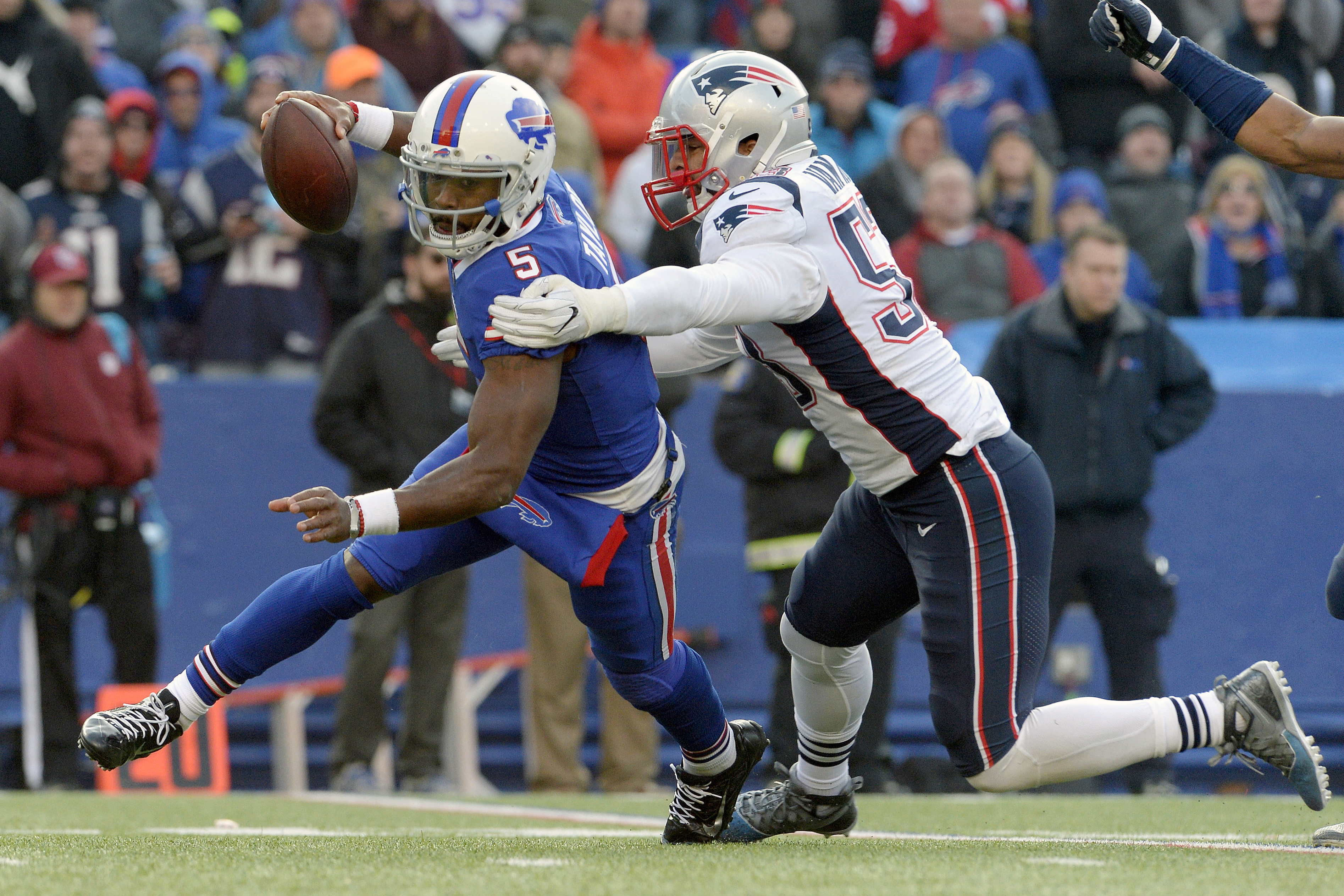 Buffalo Bills quarterback Tyrod Taylor (5) is sacked by New England Patriots outside linebacker Kyle Van Noy (53) during the second half of an NFL football game, Sunday, Dec. 3, 2017, in Orchard Park, N.Y. (AP Photo, Adrian Kraus)