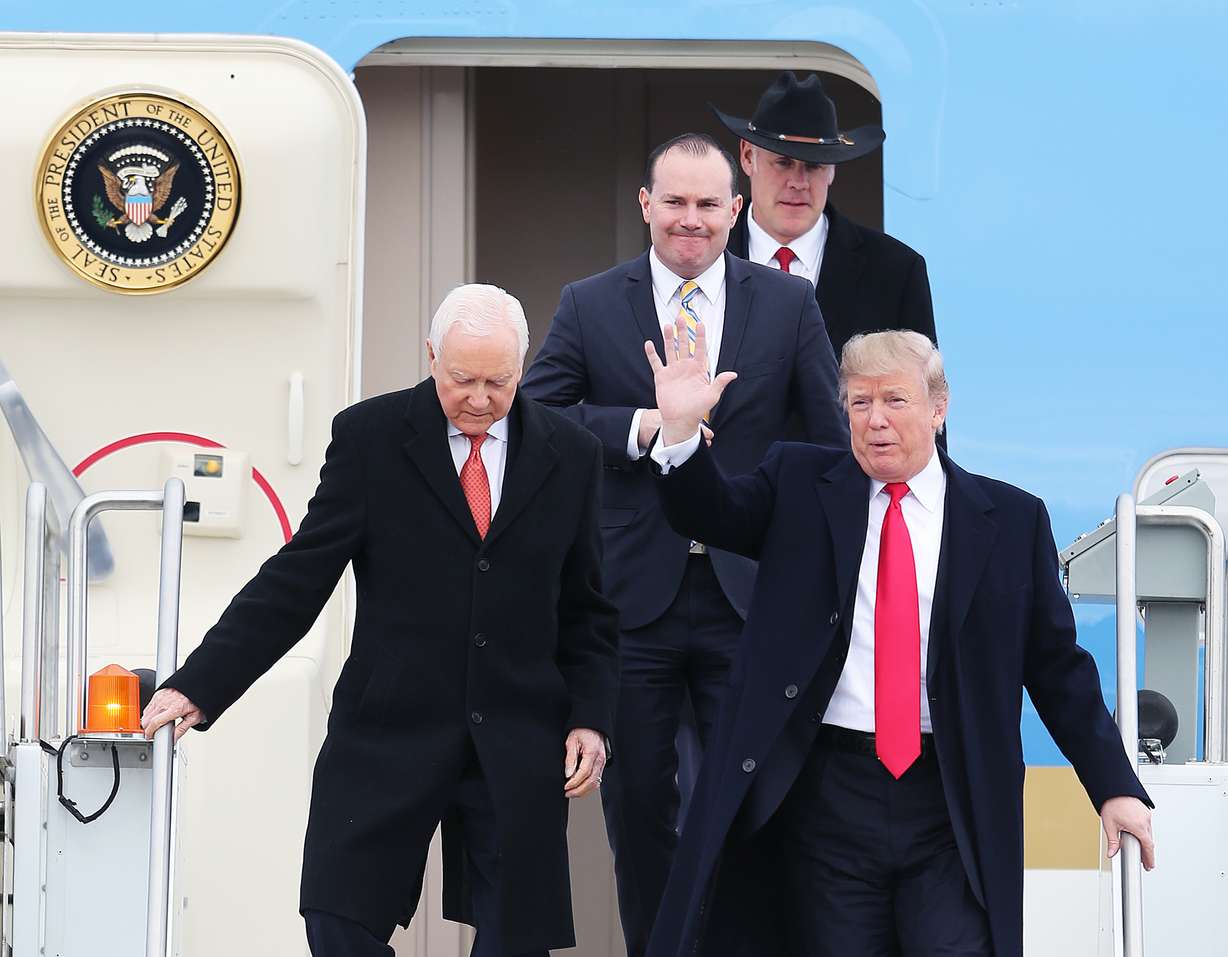President Donald Trump steps off Air Force One with Utah Sens. Orrin Hatch, left, and Mike Lee, and Interior Secretary Ryan Zinke at Roland R. Wright Air National Guard Base at the Salt Lake City International Airport in Salt Lake City on Monday, Dec. 4, 2017. Photo: Scott G Winterton, KSL