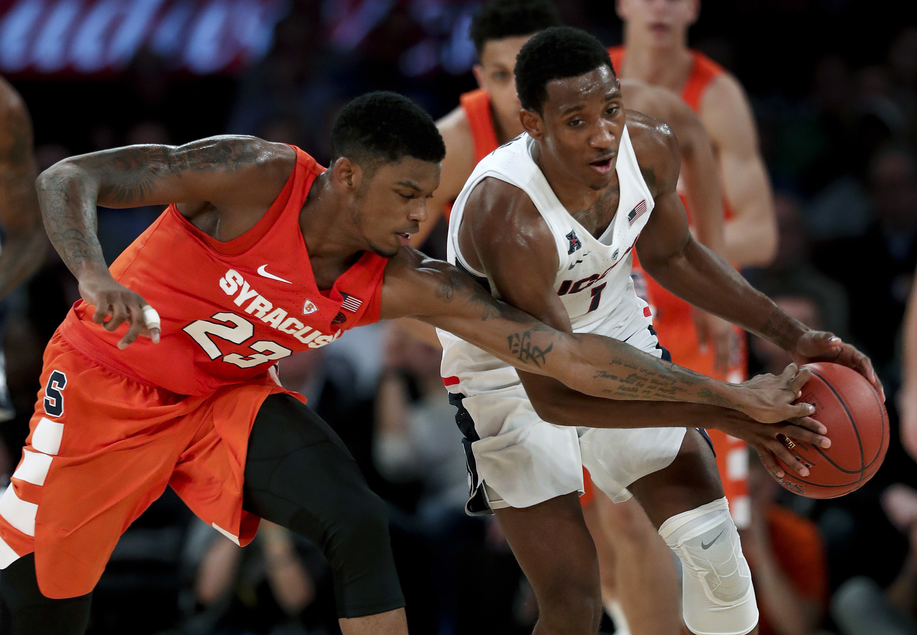 Brissett's double-double lifts Syracuse past UConn 72-63