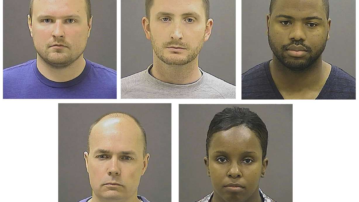 The Latest: Court hears 5 officers' bid to sue a prosecutor