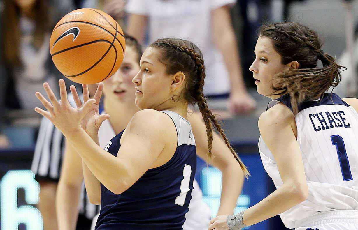 Utah State guard Eliza West (1) reaches for the ball after a bad bounce as BYU and Utah State play an NCAA women's basketball game in Provo on Wednesday, Dec. 6, 2017. Utah State won 76-69. (Photo: Scott G Winterton, Deseret News)