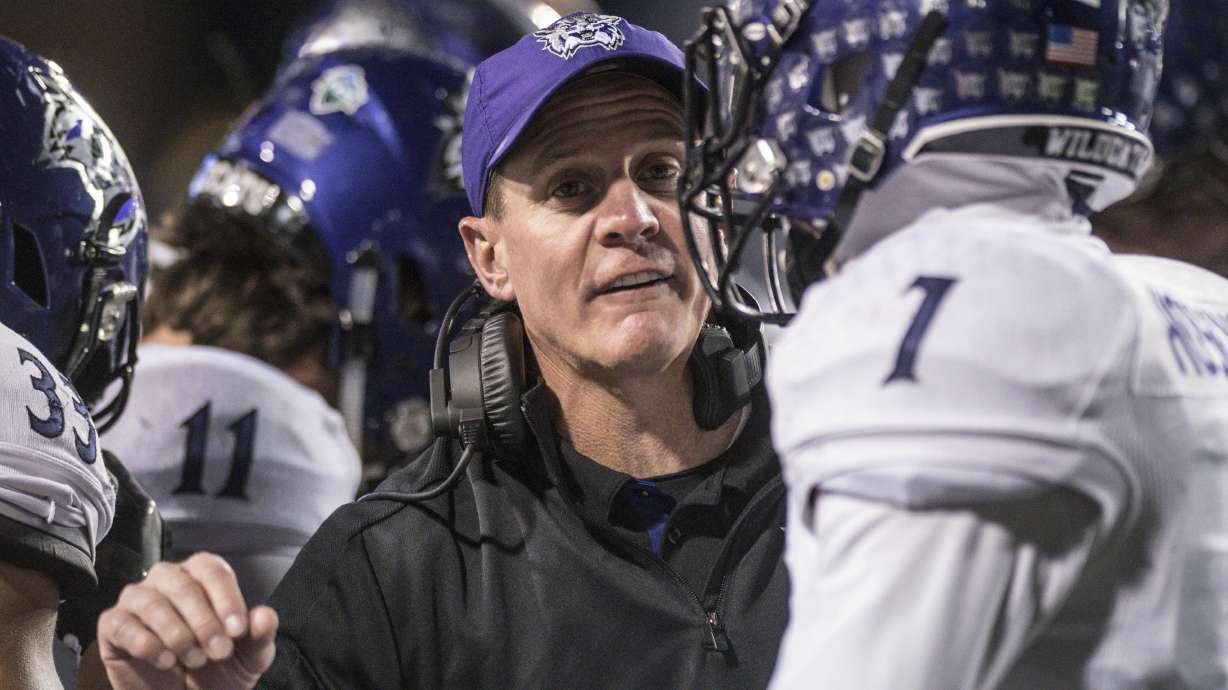 Weber State coach Jay Hill talks to one of his players during an FCS playoff game, Dec. 8, 2017 in Virginia.