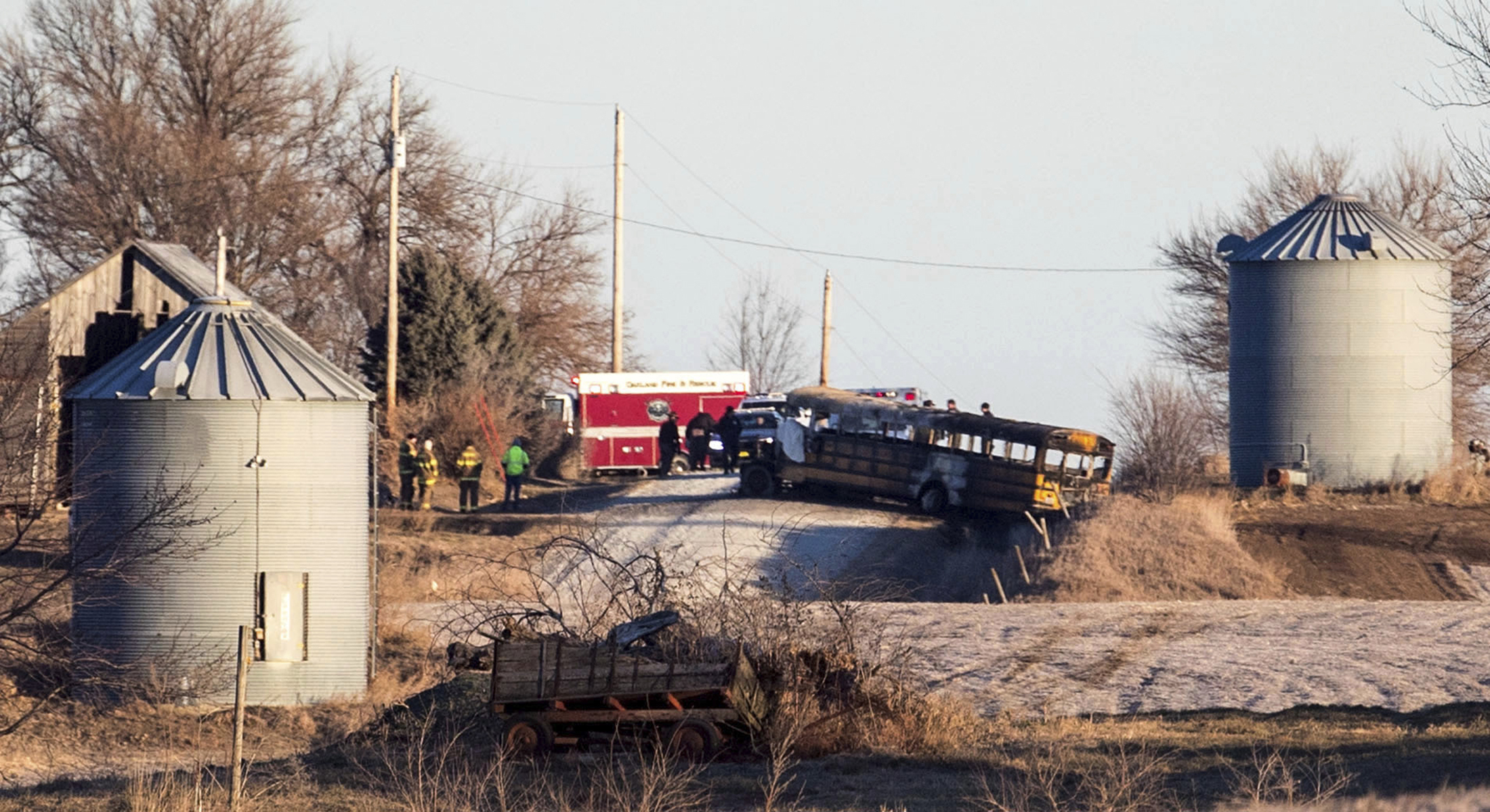 The Latest: 2 people killed in school bus fire identified