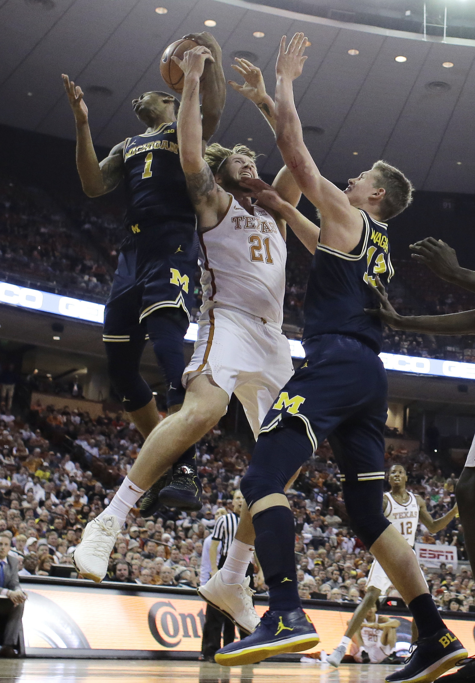 Abdur-Rahkman leads Michigan over Texas 59-52