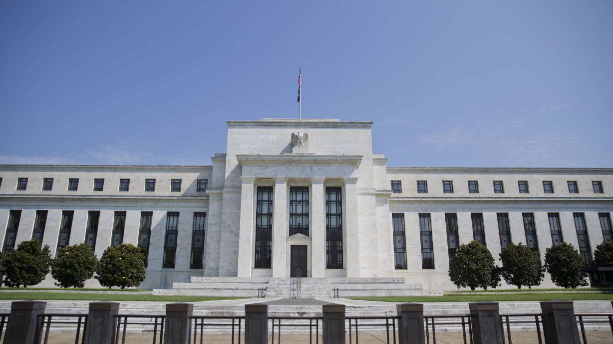 The Latest: China raises key policy rate after Fed's hike