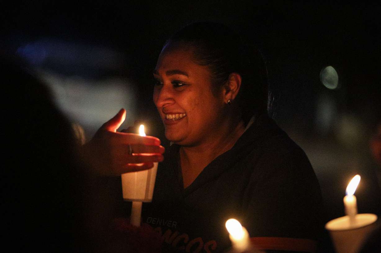Jenna Griego, Alice Griego's daughter, listens as friends tell stories about Alice Griego during a vigil for her and Ralph Salazar in Sandy on Thursday, Dec. 14, 2017. Five years ago Griego and Salazar were shot and killed inside their home on Salt Lake County's east bench and then set on fire. (Photo: Adam Fondren, KSL)