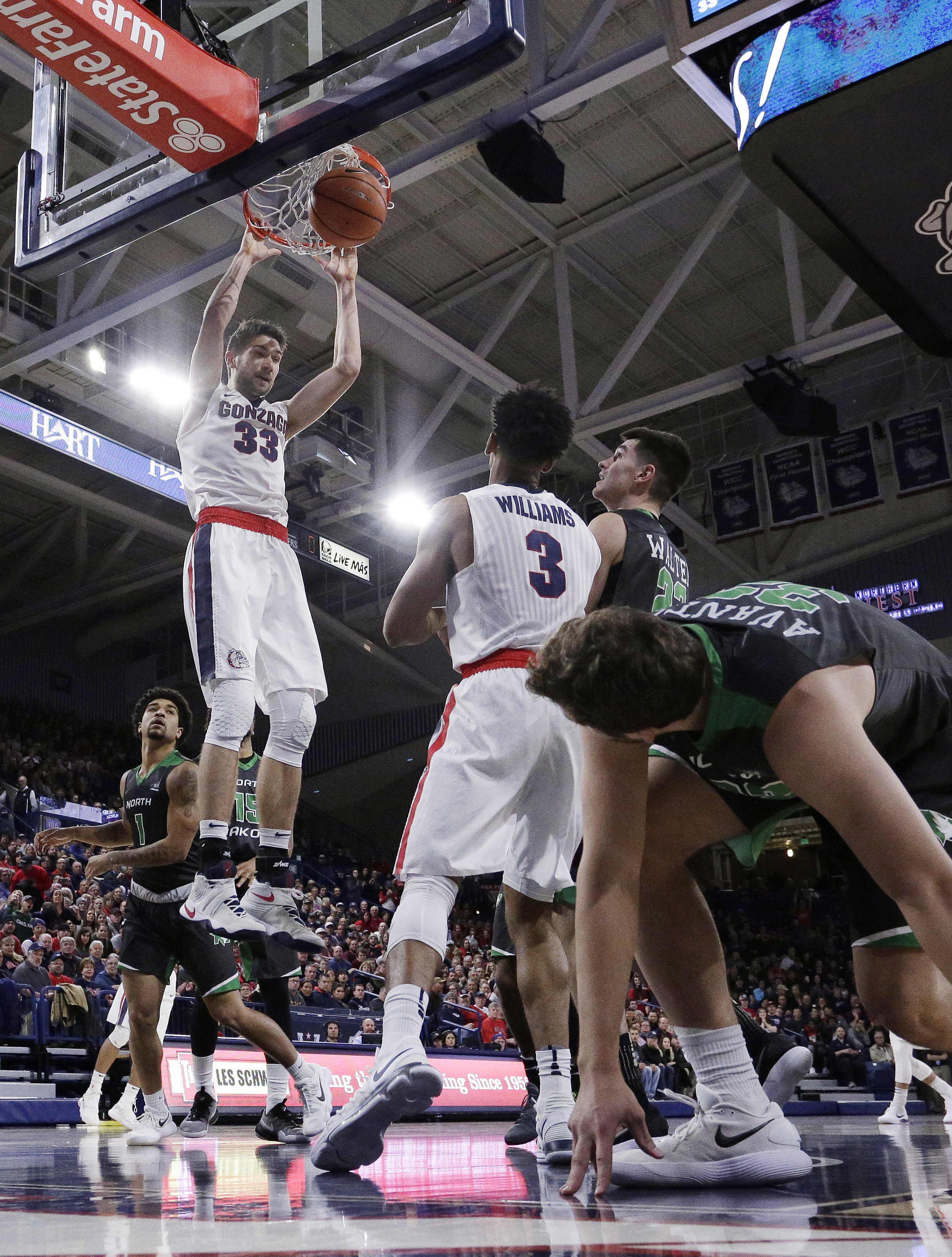 Perkins leads No. 12 Gonzaga over North Dakota 89-83 in OT