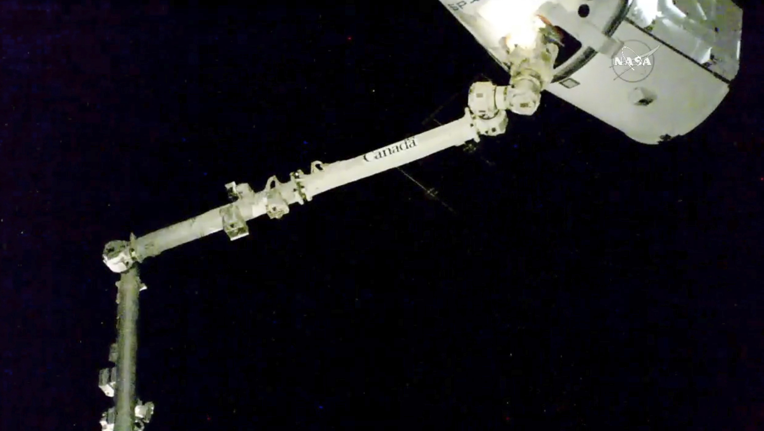 SpaceX capsule back at space station with pre-Christmas haul