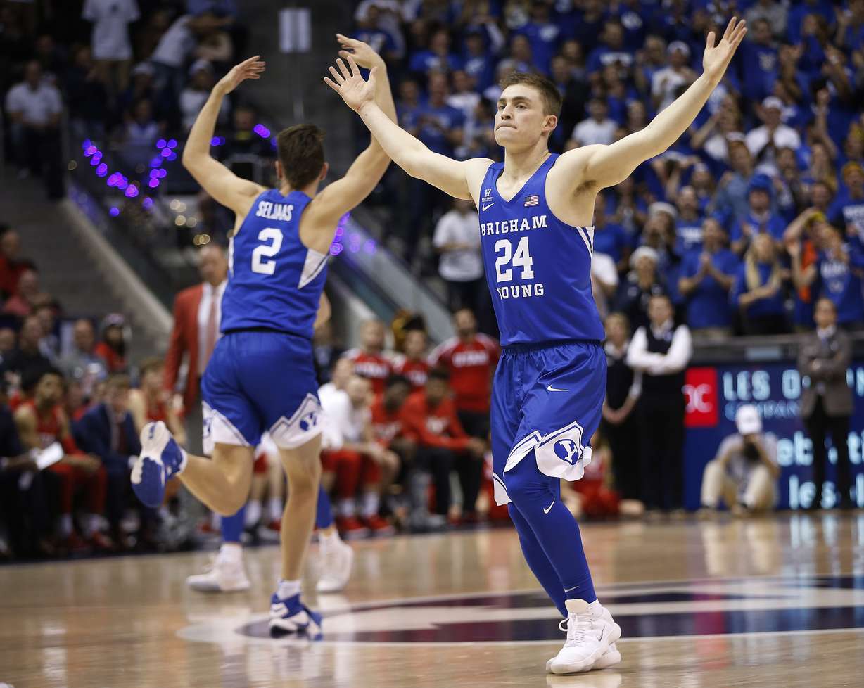 BYU guard McKay Cannon (24) and BYU guard Zac Seljaas (2) celebrate the win over Utah in Provo on Saturday, Dec. 16, 2017. BYU won 77-65. (Photo: Jeffrey D. Allred, Deseret News)
