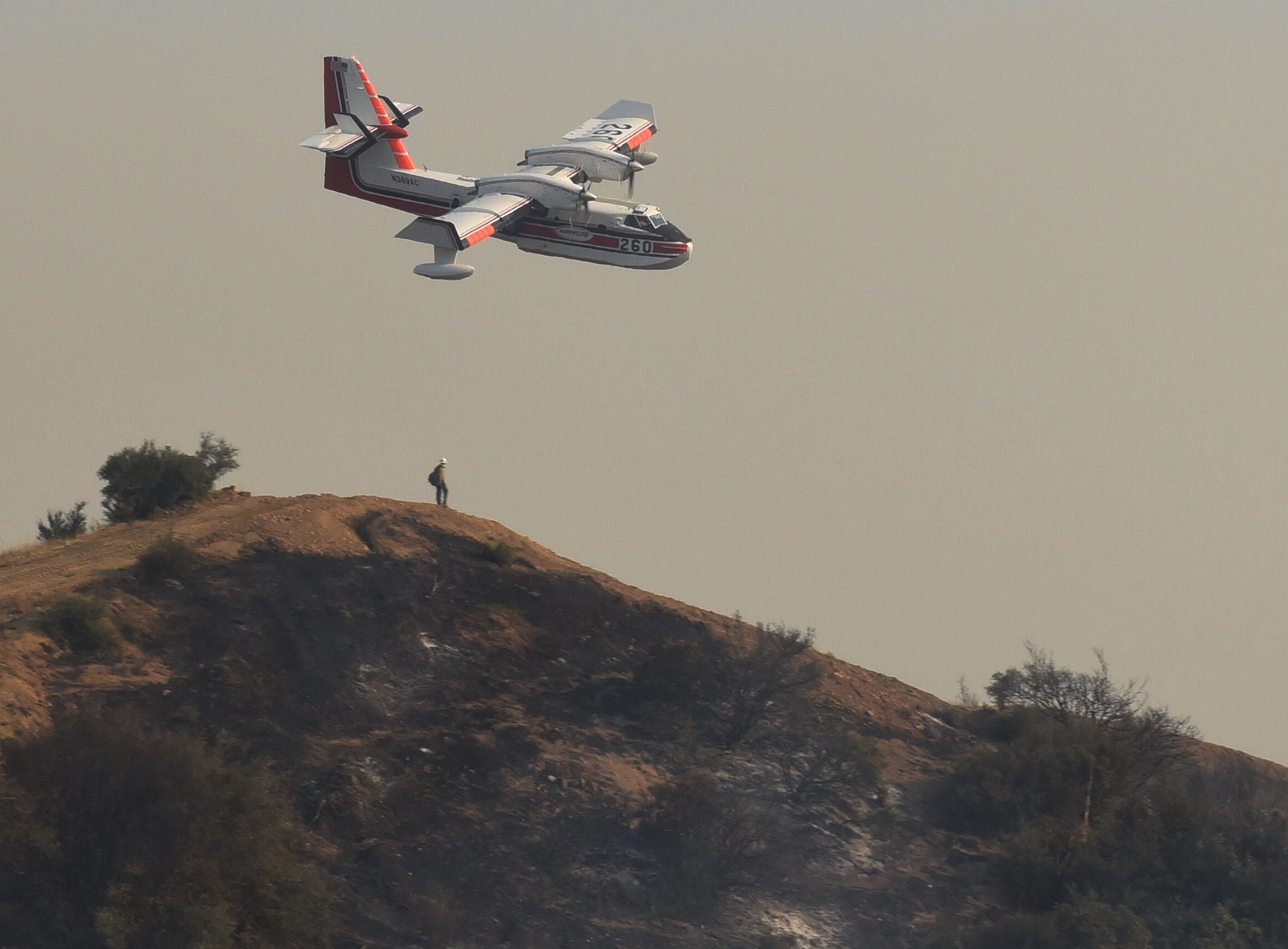 The Latest: Massive California wildfire half contained