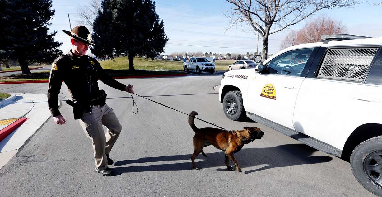 Utah Highway Patrol trooper Randy Riches and his K-9 Terro prepare to give a demonstration at a press event as agents provide end-of-year drug seizure totals and give a demonstration of a K-9 drug search in Taylorsville on Monday, Dec. 18, 2017. (Photo: Scott G Winterton, KSL)