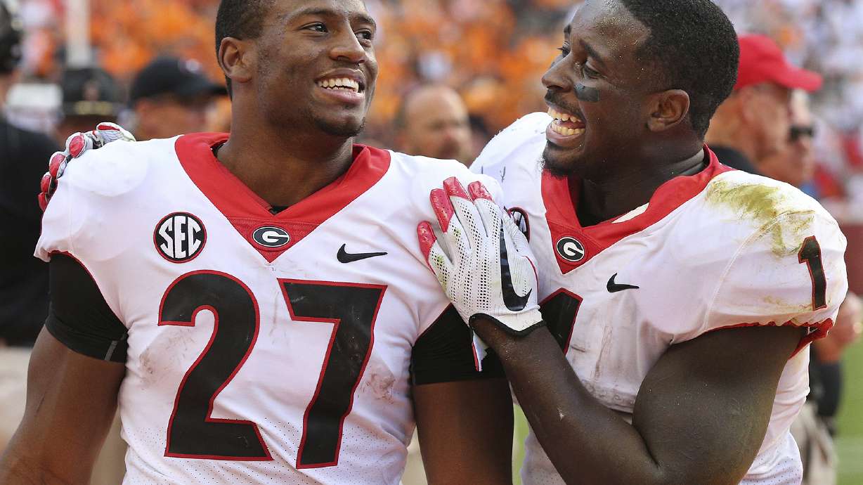Dogs' Chubb, Michel happy they returned for senior seasons