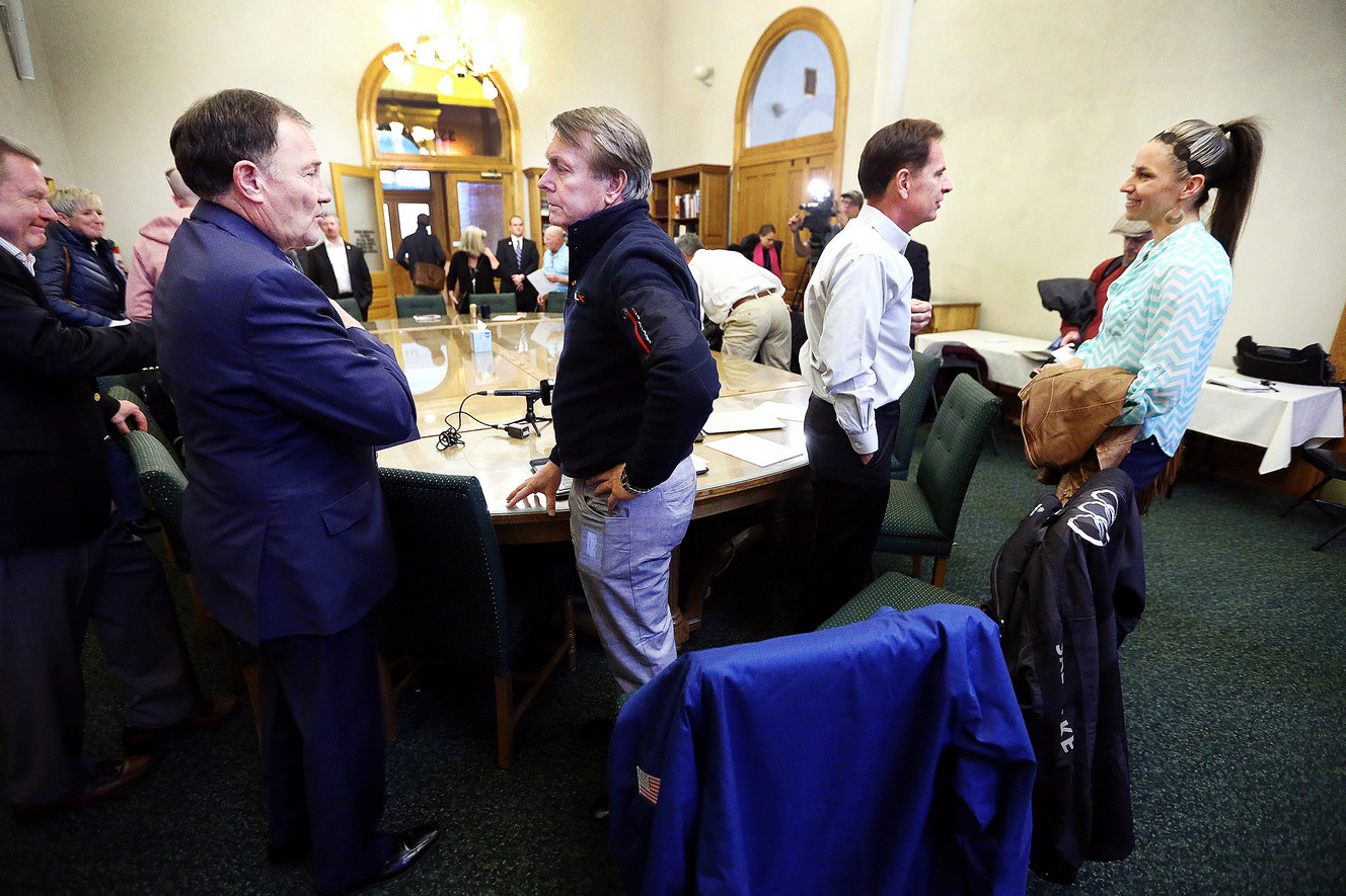 Gov. Gary Herbert and Jeff Robbins, president and CEO of the Utah Sports Commission, Fraser Bullock former COO of the SLOC for the 2002 Games and former Olympian Noelle Pikus-Pace talk after the OEC Board meeting at the Salt Lake City-County Building in Salt Lake to discuss progress on Salt Lake City hosting another Olympic Games, on Monday, Dec. 18, 2017. (Photo: Scott G Winterton, KSL)