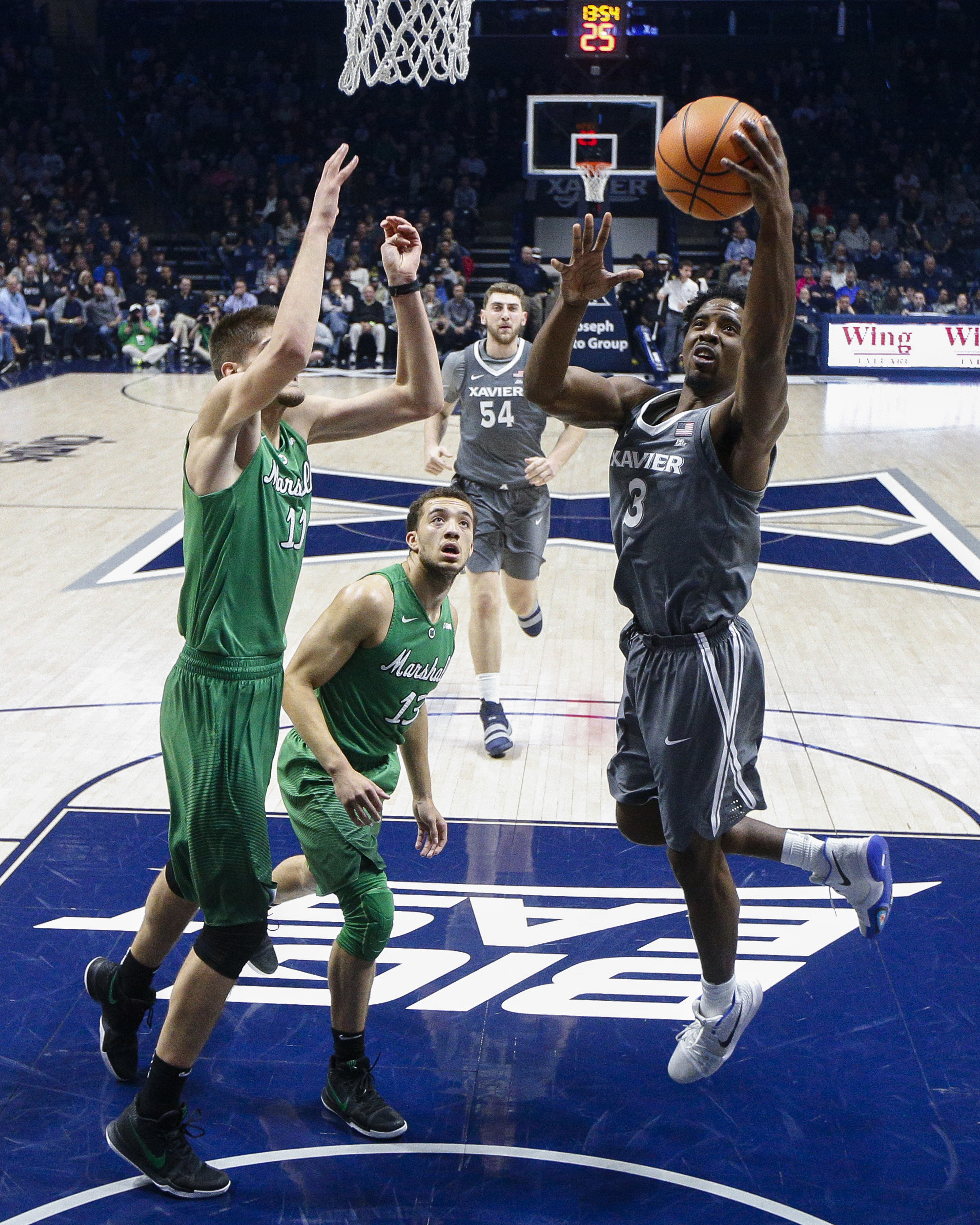 No. 9 Xavier holds off Marshall, 81-77