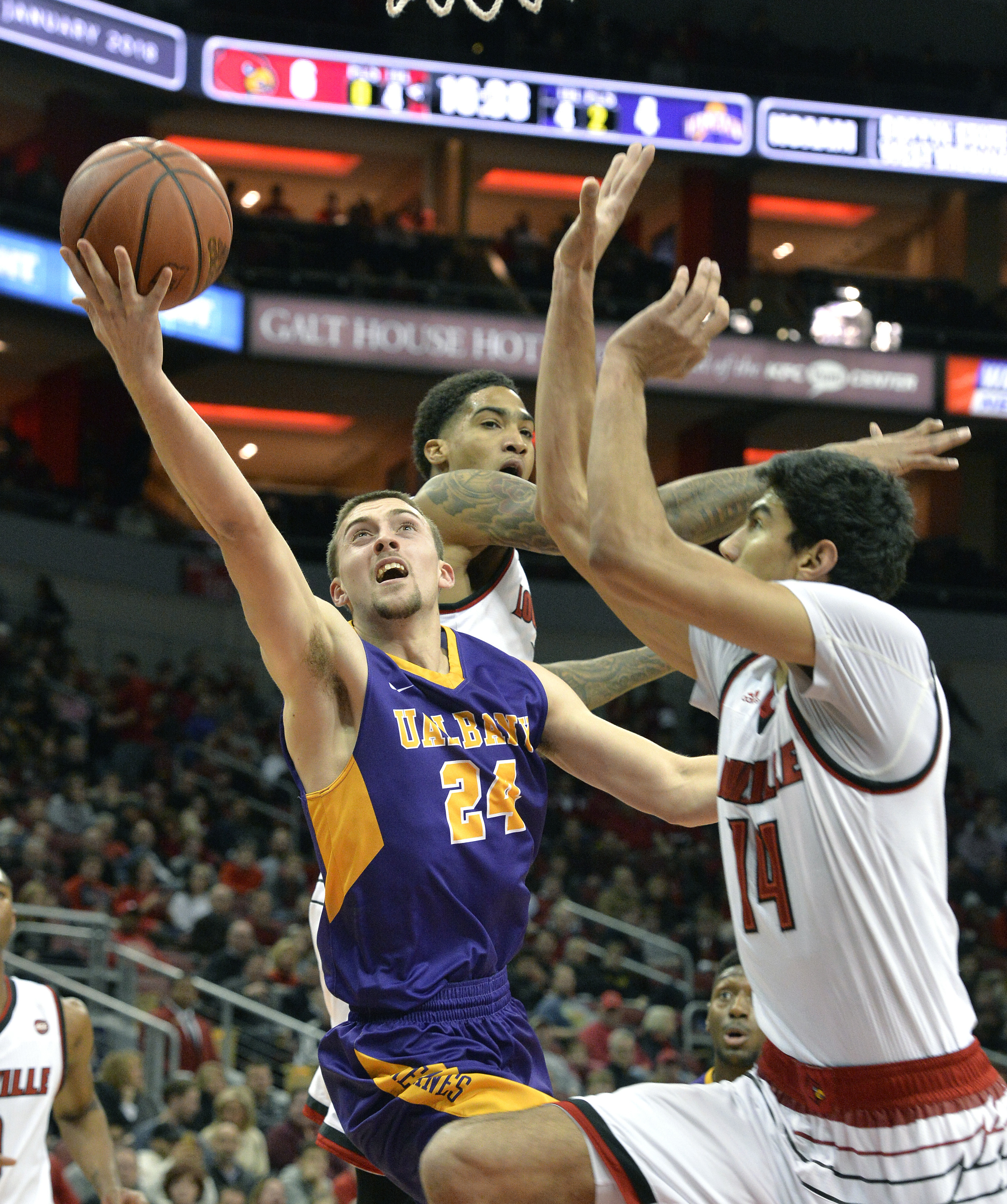 Spalding's jumper lifts Louisville past Albany 70-68