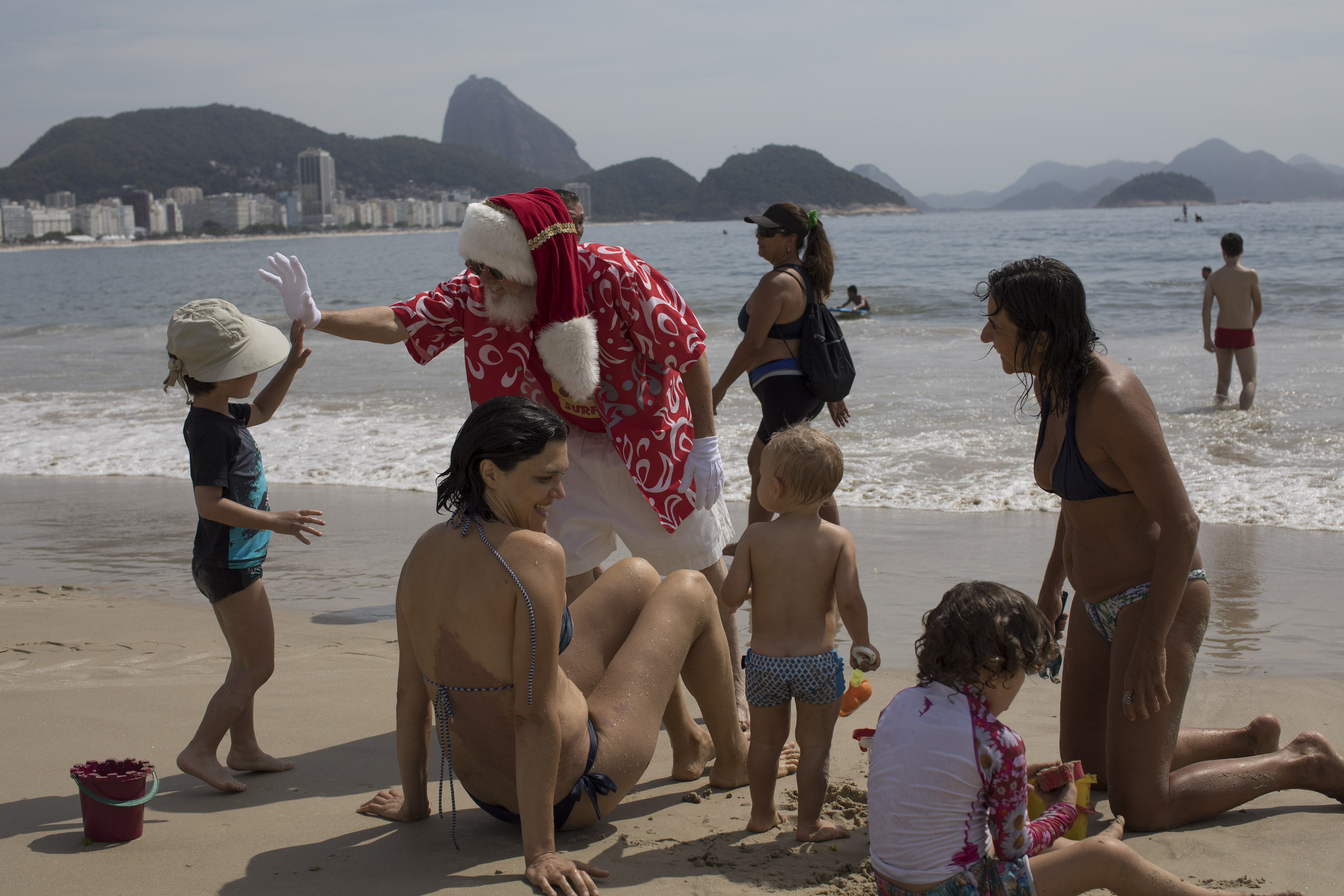 Santa, with surfboard, celebrates Brazil's 1st day of summer