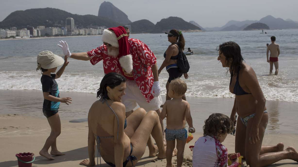 Santa, with surfboard, celebrates Brazil's 1st day of summer