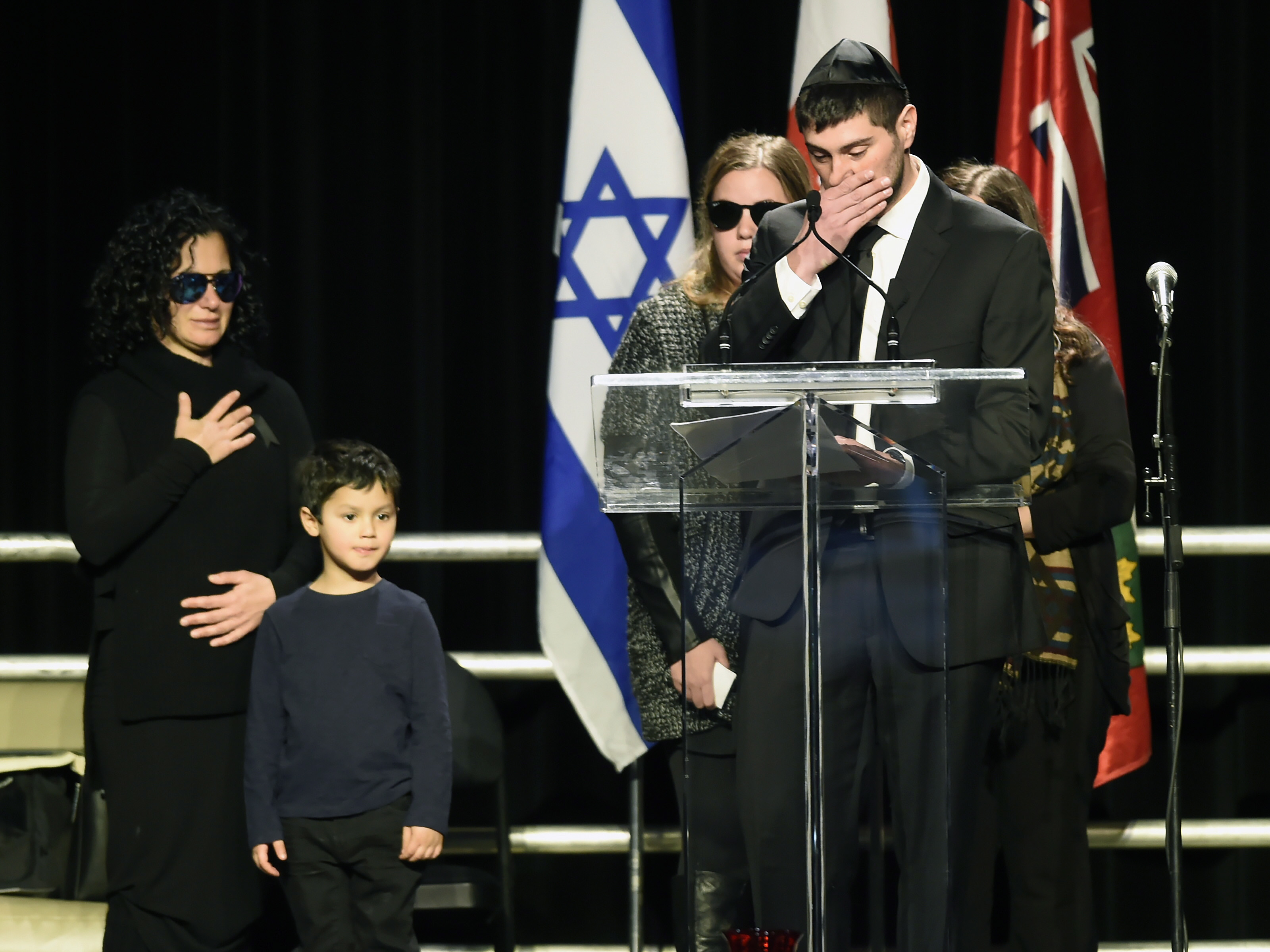 Mourners pay tribute to Toronto billionaires found dead