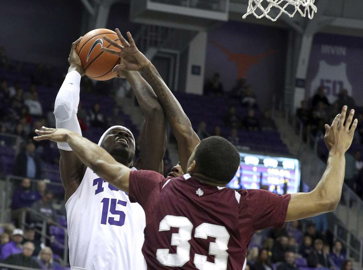 TCU forward JD Miller (15) shoots over Texas Southern guard Robert Lewis (33) during an NCAA college basketball game, Monday, Dec. 18, 2017. (AP Photo/Richard W. Rodriguez)