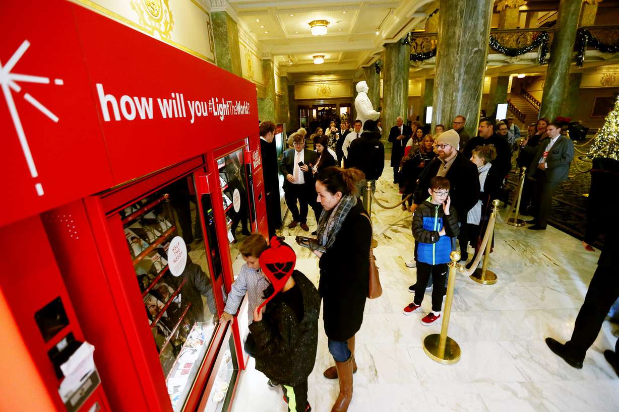Visitors to the Joseph Smith Memorial Building in Salt Lake City form a line at the Light the World charity vending machines on Friday, Dec. 15, 2017. (Photo: Scott G Winterton, KSL)