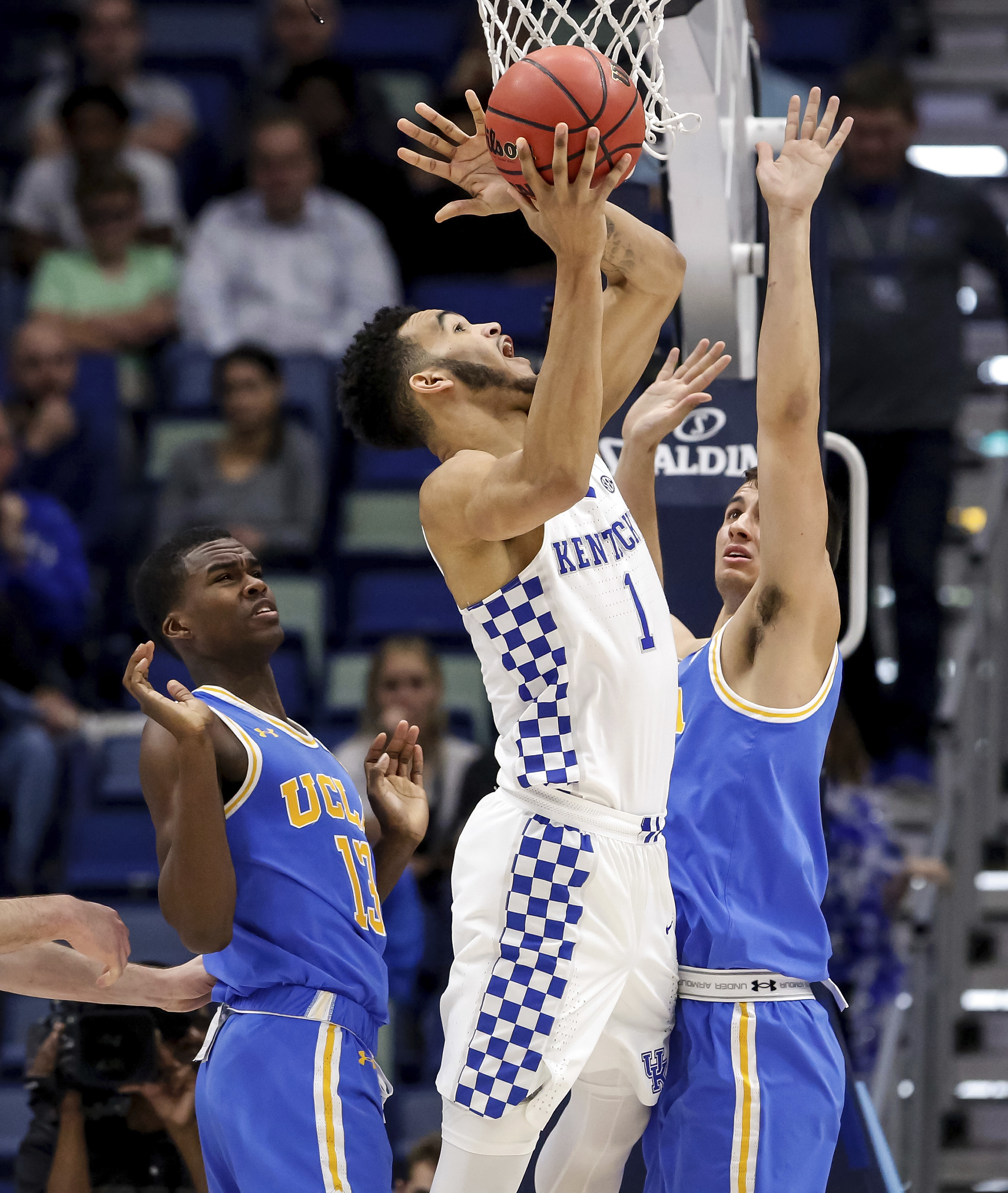 Holiday, Wilkes, lead UCLA to upset of No. 7 Kentucky, 83-75