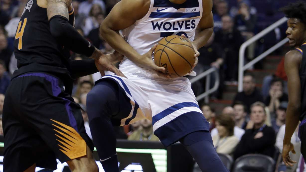 Butler leads balanced Timberwolves past Suns 115-106