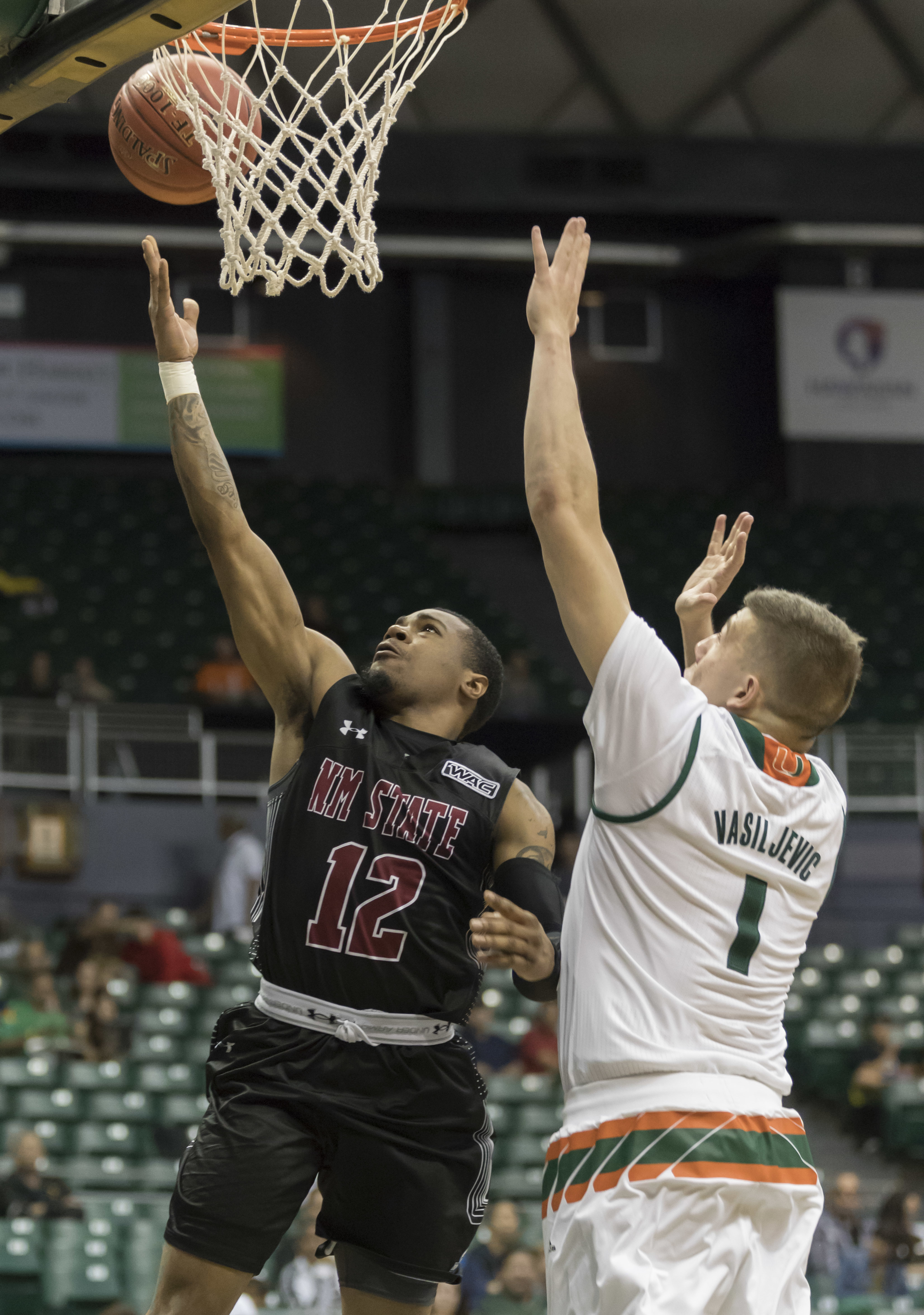 New Mexico State knocks off No. 6 Miami 63-54 in Hawaii