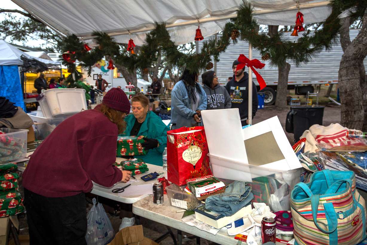 In this Dec. 15, 2017 photo provided by Kim Porter, volunteers are shown getting gift packages together to distribute at the Rockport Relief Camp in Rockport, Texas. Photo: Kim Porter