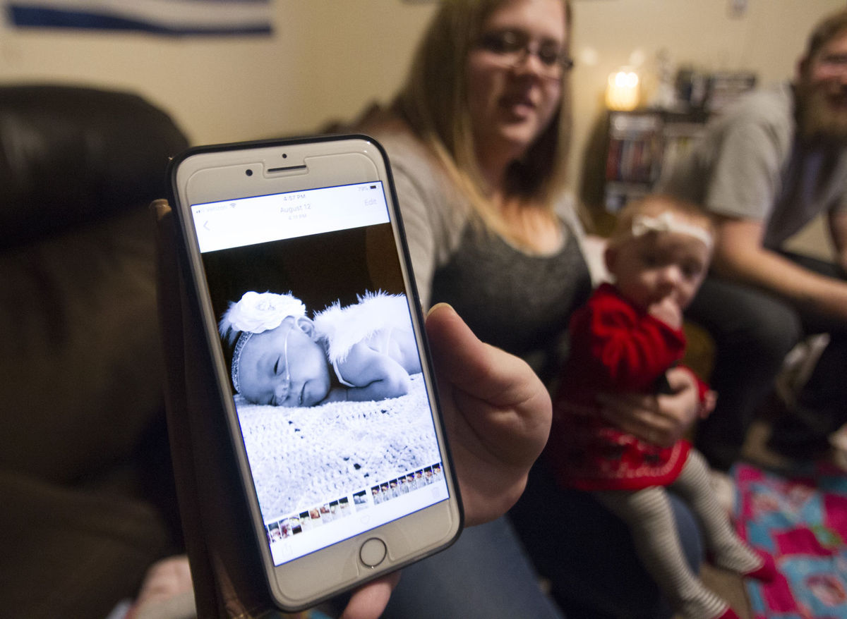 Samantha Crabb, 24, shows off a photo of her daughter Rainna Friday afternoon, Dec. 8, 2017, in Hansen, Idaho. Rainna, who is 9 months old now, was born prematurely at 24 weeks. (Photo: Drew Nash, Times-News)
