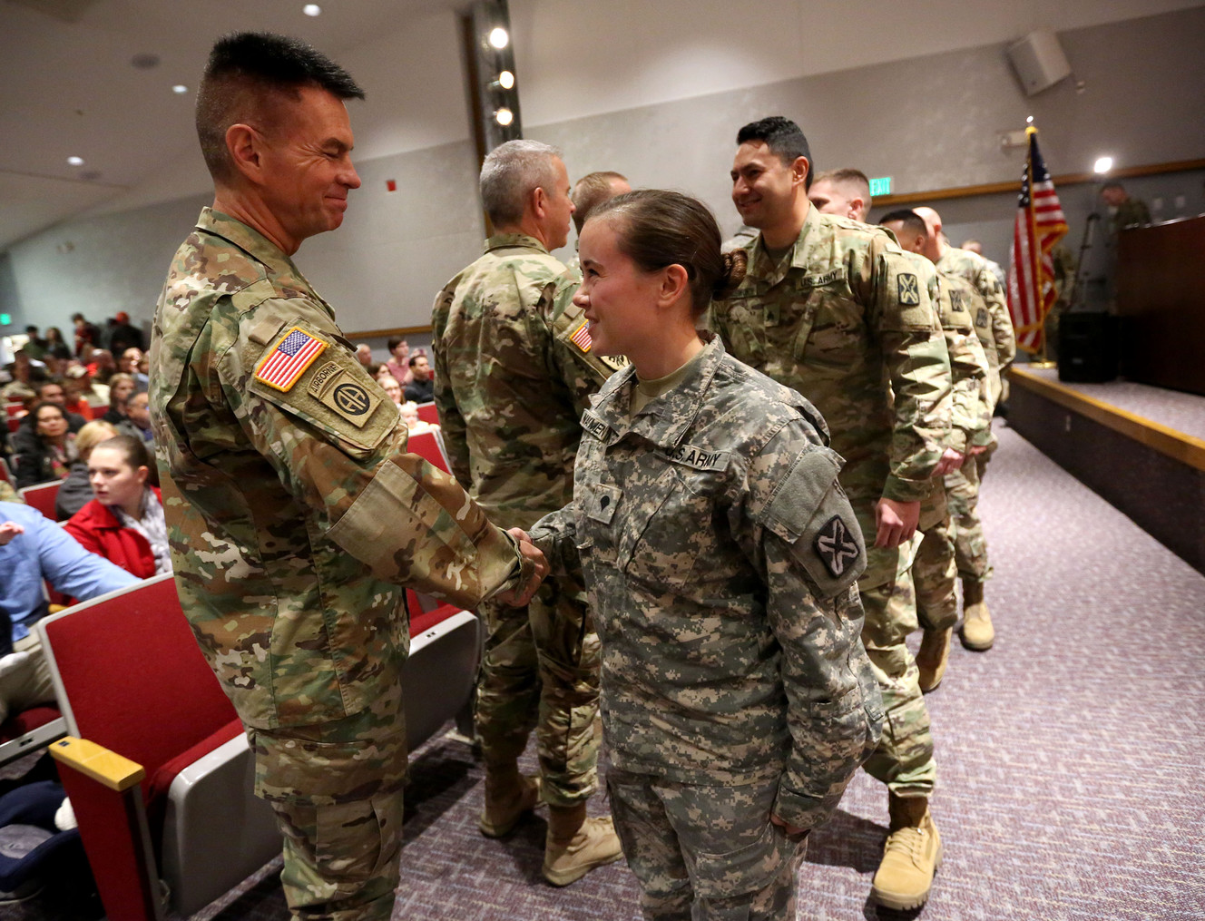 Gen. Jeff Burton shakes hands with Spc. Brittany Wayment during a departure ceremony at the Utah National Guard headquarters in Draper on Thursday, Dec. 28, 2017. Fifteen soldiers from the Guard’s 142nd Military Intelligence Battalion are leaving for a 12-month deployment to Afghanistan in support of Operation Freedom Sentinel. (Photo: Kristin Murphy, KSL)