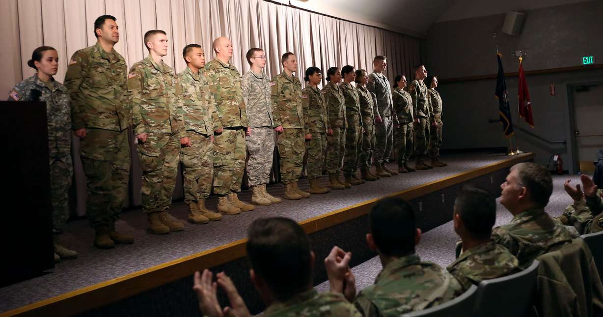 Fifteen soldiers from the Utah National Guard’s 142nd Military Intelligence Battalion pose for photos during a departure ceremony at Guard headquarters in Draper on Thursday, Dec. 28, 2017. They are leaving for a 12-month deployment to Afghanistan in support of Operation Freedom Sentinel. (Photo: Kristin Murphy, KSL)