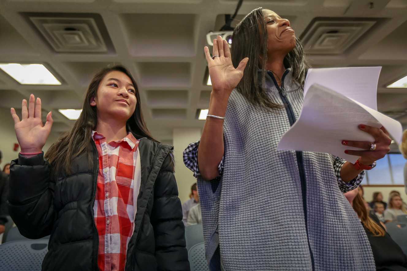 Hong Nguyen, left, from Vietnam, takes the oath of allegiance with the help of Rep. Mia Love, R-Utah, during a citizenship ceremony for children at the U.S Citizenship and Immigration Services' office in Salt Lake City on Thursday, Dec. 28, 2017. (Photo: Adam Fondren, KSL)