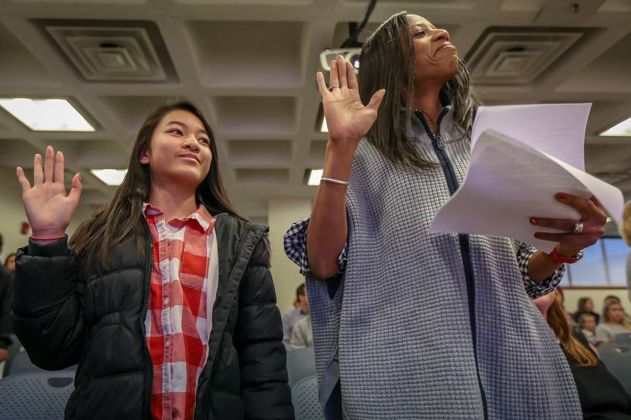Hong Nguyen, left, from Vietnam, takes the oath of allegiance with the help of Rep. Mia Love, R-Utah, during a citizenship ceremony for children at the U.S Citizenship and Immigration Services' office in Salt Lake City on Thursday, Dec. 28, 2017. (Photo: Adam Fondren, KSL)