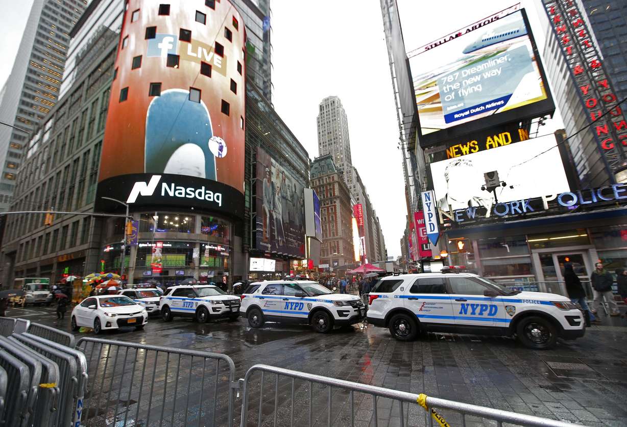 In this Dec. 29, 2016 file photo, a row of New York City police cars is parked along a street in New York's Times Square. Photo: Kathy Willens, AP Photo, File