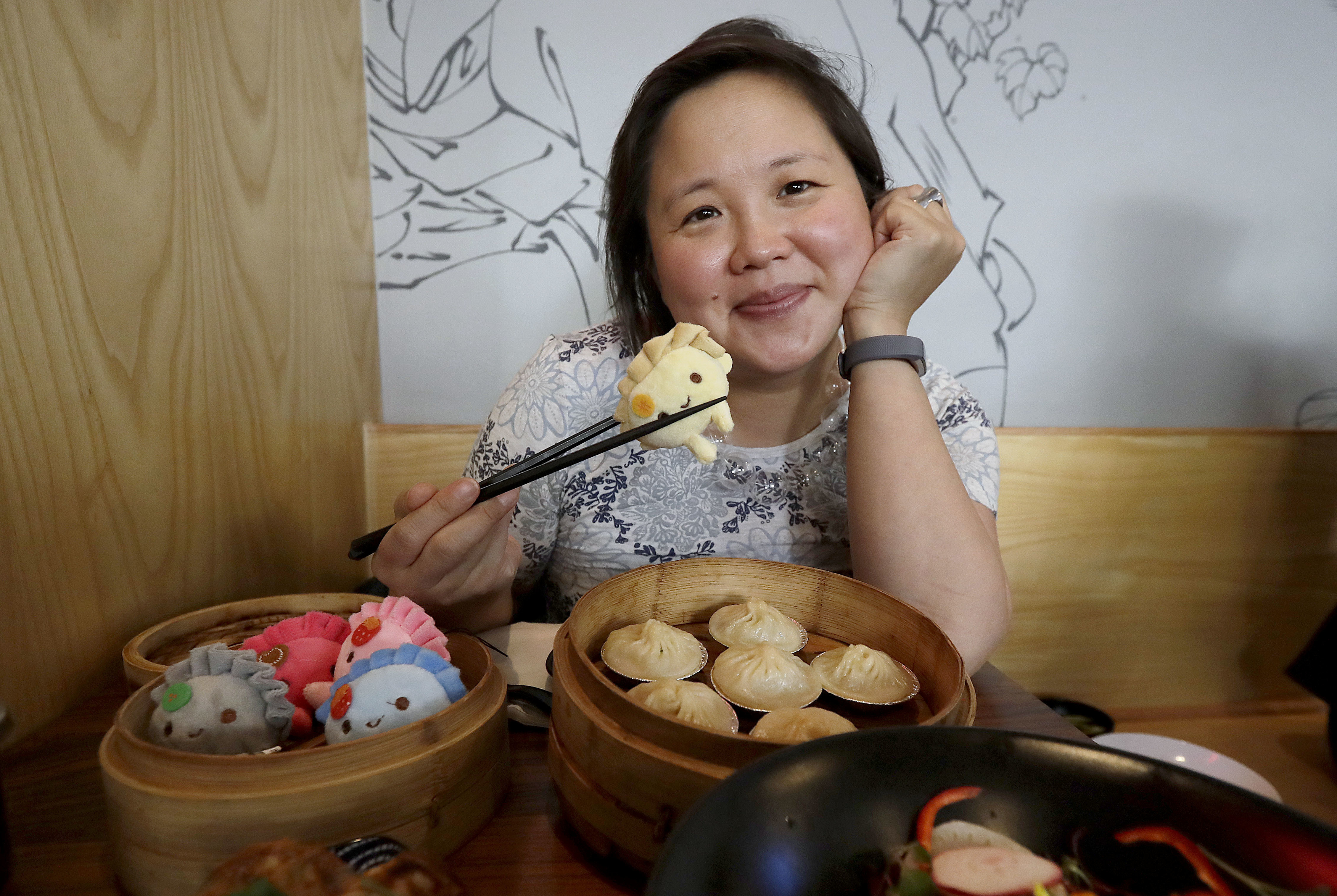 In this Wednesday, Dec. 27, 2017, photo, author Jennifer 8. Lee poses for photos before eating lunch at Dumpling Time restaurant in San Francisco. Photo: Jeff Chiu, AP Photo