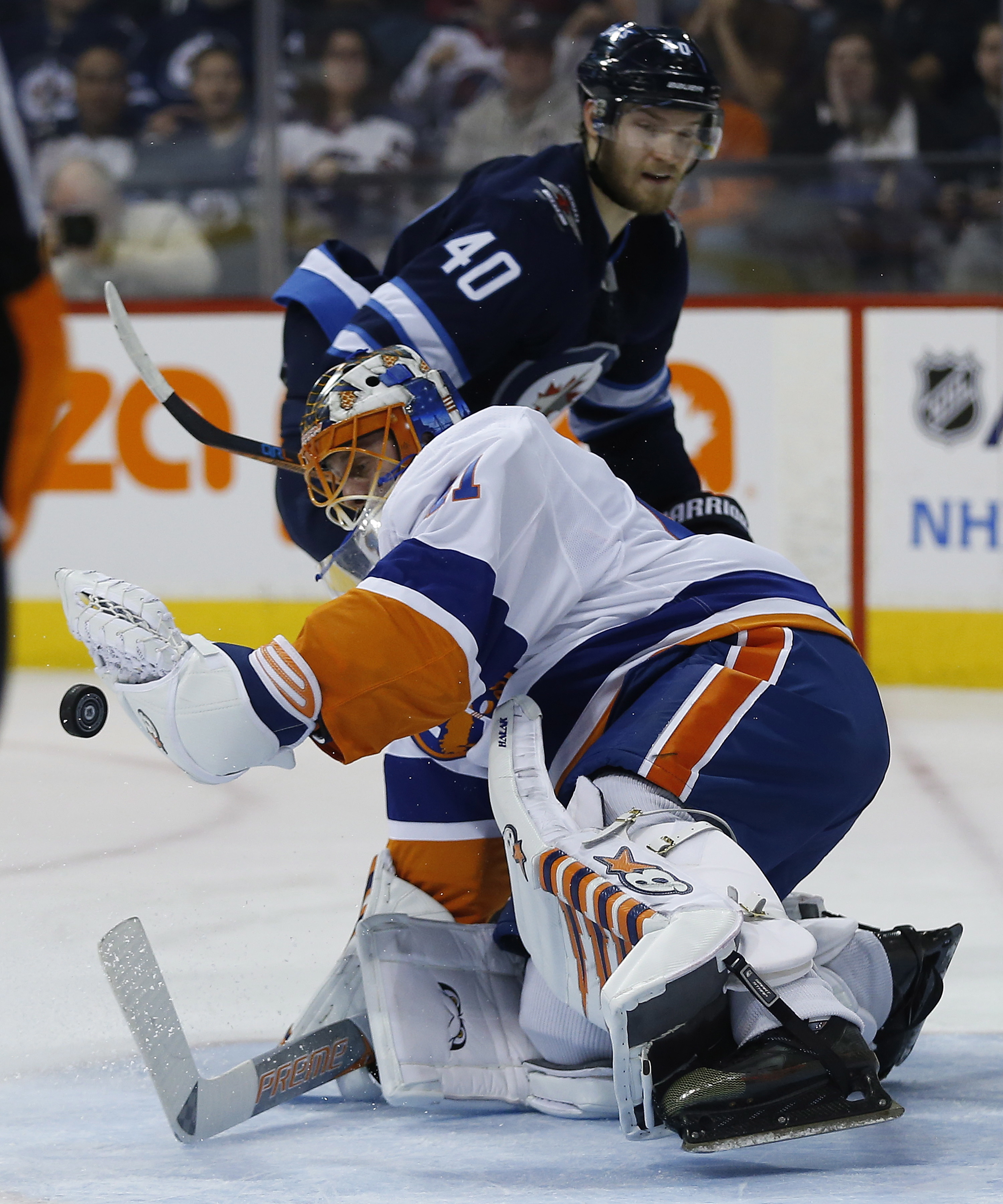 Wheeler, Connor help Jets beat Islanders 4-2