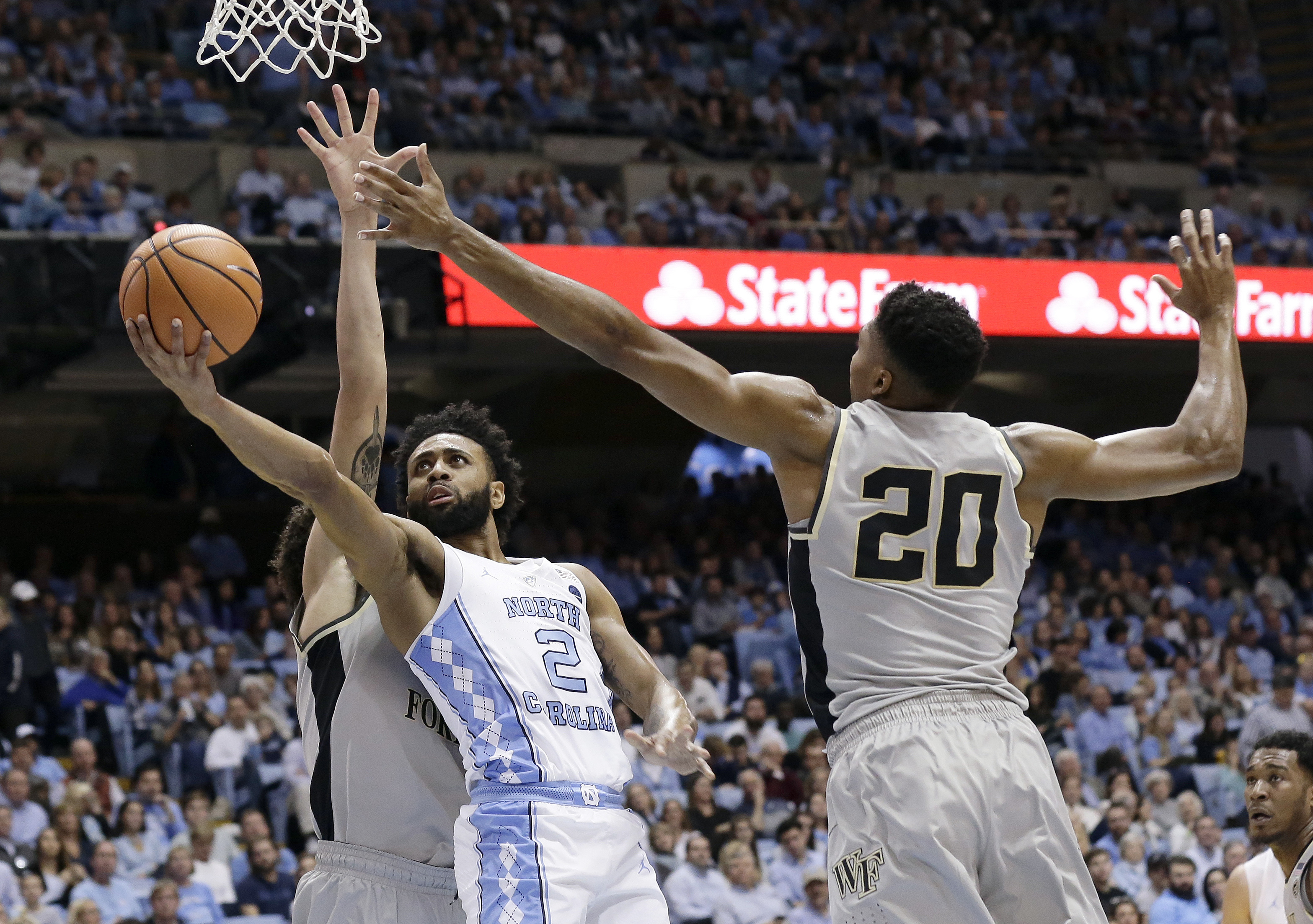 No. 13 UNC holds off Wake Forest 73-69 in ACC opener