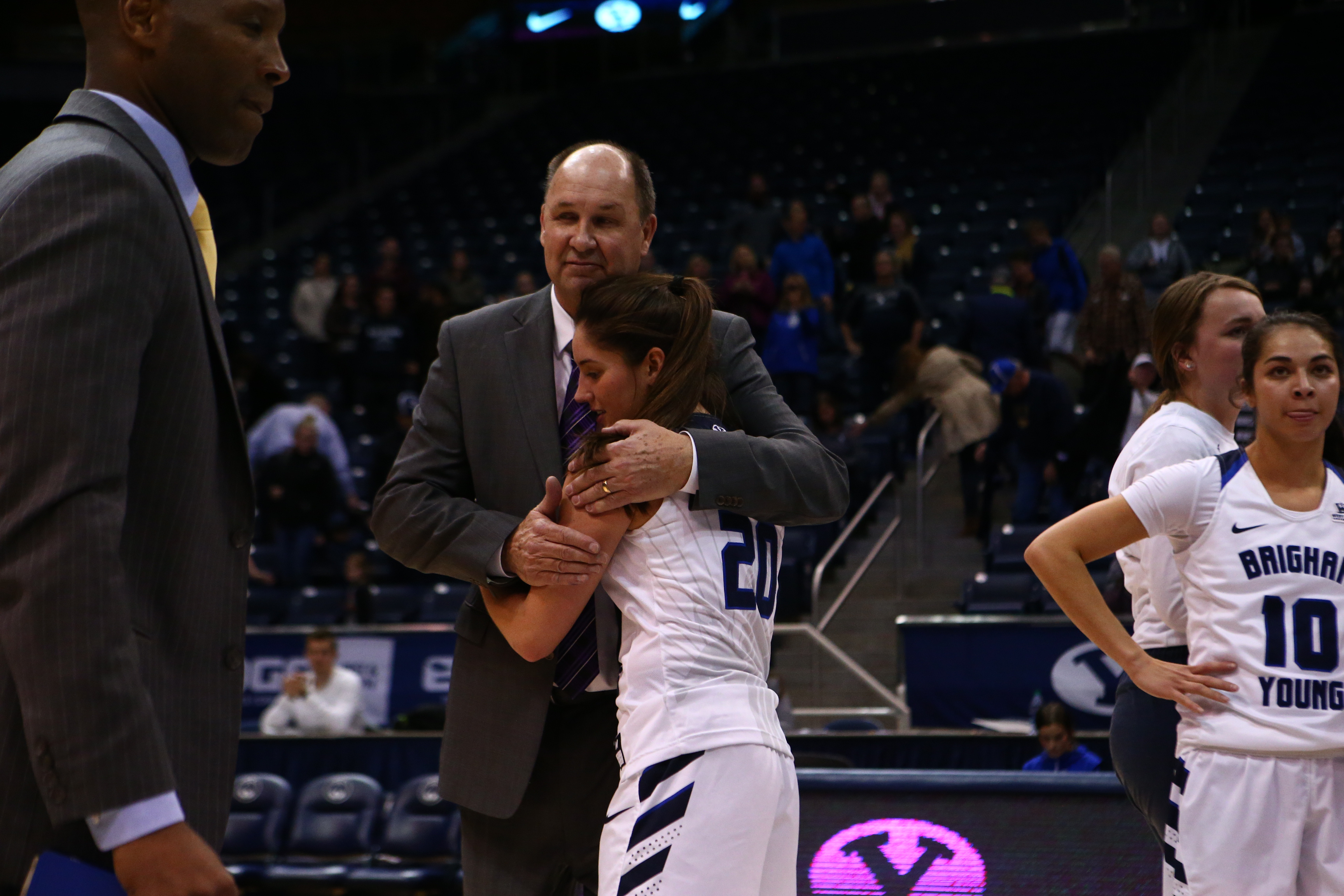 BYU women's basketball coach Jeff Judkins congratulates point guard Cassie Broadhead Devashrayee after the senior scored her 1,000th career point Thursday, Jan. 4, 2017 against San Francisco. (BYU Photo)