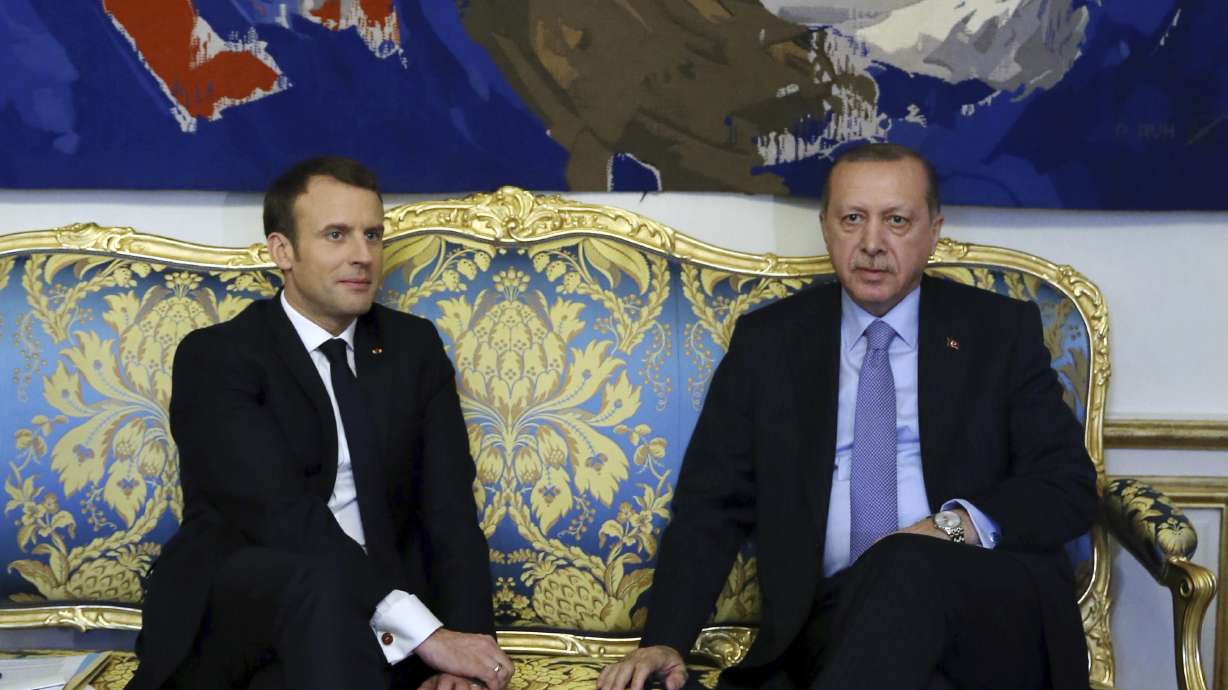 The Latest: In Paris, Erdogan calls Turkey a 'state of law'