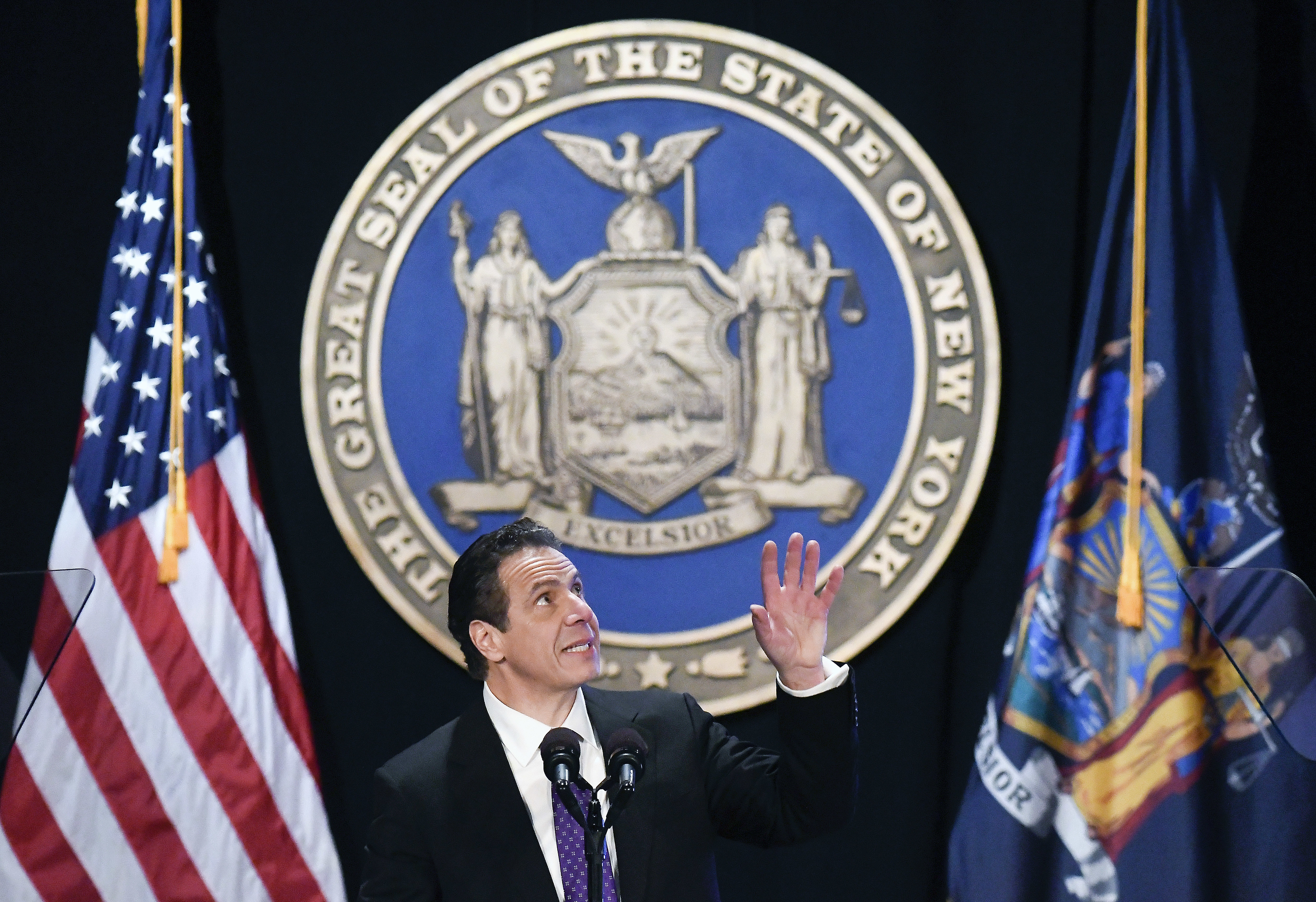 New York Gov. Andrew Cuomo makes reference to his father Mario Cuomo as he delivers his state of the state address at the Empire State Plaza Convention Center in Albany, N.Y. on Wednesday. During the speech, Cuomo pledged to sue over the new federal tax plan, which he called “an assault” by the federal government. (AP Photo)
